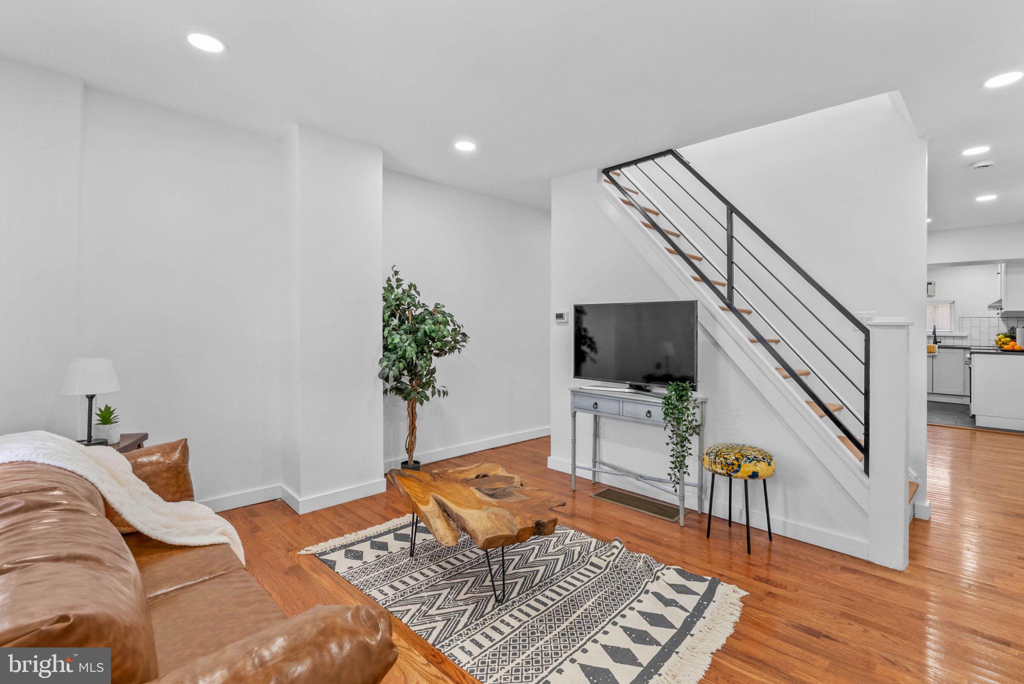 Welcome to 5942 Norwood Street! This 2 bedroom, 1.5 bath home has been completely gutted and transformed in a full renovation taken all the way down to the studs and completed November 2025! 

Every major system has been replaced from top to bottom, including all-new plumbing, electrical, Central HVAC, hot water tank, recessed lighting, new half bath on the main level and all new appliances in the kitchen, bathrooms and laundry area. EVERYTHING is backed by active manufacturer’s warranties that can transfer to the buyer. Real hardwood flooring flows throughout the entire home complemented by designer ceramic tile in the kitchen and bathrooms creates a warm yet stylish environment perfect for starter home or empty nesters. Investor's can anticipate rent rates between $1400-1600mo. - that's a cap rate between 4.8-5.3% at the current asking price. (THIS IS NEGOTIABLE FOR INVESTORS AND FTHB ALIKE).
The main level is bright  with floods of natural light. The kitchen features custom Quartz  countertops and energy efficient stainless-steel appliance.
Upstairs you’ll find two neatly fitted bedrooms and the main bathroom complimented by an Allora Porcelain Matte Black Tile accent wall. 

The home includes an unfinished basement stretching the length of the home and a raw backyard, offering even more flexibility and instant home equity add to a new homeowner. 

Situated 1 block from Fresh Grocer, Dunkin, PNC & Rite Aid, 2 blocks from La Salle University, under 5 mins to Awbury Arboretum, and less than 10 mins to the two major shopping plazas on Cheltenham Ave including Target, Walmart, Home Depot, Starbucks, ShopRite, Chick-fil-A & much much more.