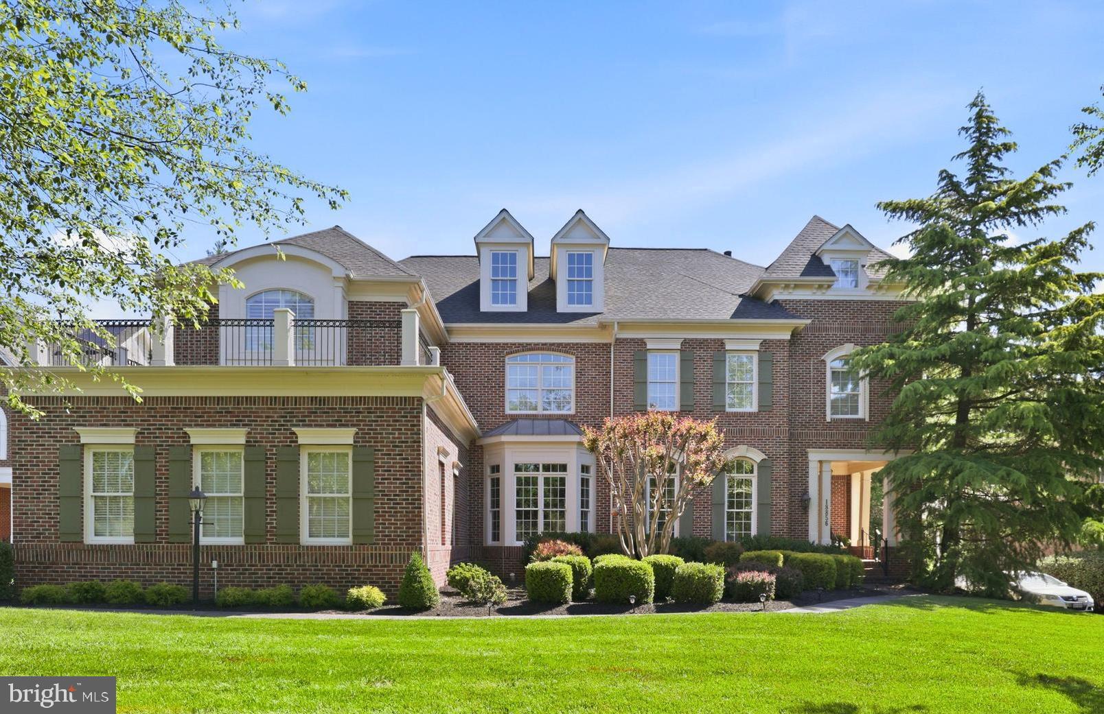 Set on nearly half an acre at the end of a quiet cul-de-sac in one of Lansdowne on the Potomac's most desirable locations, this exceptional Bentley model offers over 6,500 square feet, six bedrooms, three finished levels, and stunning views of nature from nearly every room. Positioned on the coveted back side of the community, mature trees frame both the front and rear of the property, creating a private, park-like setting that transforms with the seasons and opens to golf course views during the winter months. A spectacular multi-level composite deck with a built-in fire pit extends the living space outdoors and serves as a true centerpiece of the home.
<br><br>
A dramatic two-story foyer welcomes you with marble flooring, a curved staircase, and rich Brazilian cherry hardwood flooring that extends throughout the main level and upper foyer. Exceptional millwork includes crown molding, decorative niches, and wainscoting. The soaring two-story family room is anchored by a stone fireplace and expansive windows that fill the space with natural light while showcasing the surrounding landscape.
<br><br>
The chef's kitchen features GE Monogram stainless steel appliances, granite countertops, a large center island, decorative glass tile backsplash, and abundant cabinetry with glass display accents. Designed for both everyday living and entertaining, the kitchen flows seamlessly into the surrounding gathering spaces.
<br><br>
The main level also includes a private office overlooking the backyard, formal living room with fireplace, elegant dining room, butler's pantry, powder room, spacious laundry room with sink and cabinetry, and mudroom entry from the garage.
<br><br>
Upstairs, five spacious bedrooms provide flexibility for family and guests. New carpet installed in 2026 adds a fresh feel throughout the level. The primary suite features a fireplace, dual walk-in closets, and a beautifully remodeled spa-inspired bath completed in 2023 with porcelain tile, dual vanities, soaking tub, and oversized walk-in shower. Two Jack-and-Jill bathrooms serve the secondary bedrooms, including one distinctive bedroom with vaulted ceilings and accent windows.
<br><br>
The walkout lower level is designed for recreation and entertaining, offering a large gathering area with a gas fireplace and wet bar featuring granite countertops and a beverage refrigerator. Additional flexible spaces are ideal for hobbies, fitness, gaming, theater, or home office use. A private guest suite with an adjoining full bath provides comfortable accommodations for multigenerational living or overnight visitors.
<br><br>
Outside, the multi-level composite deck feels suspended among the treetops and overlooks the first hole of Lansdowne's Sharkbite golf course. Complete with built-in bench seating and a fire pit, it offers a unique outdoor living experience. A walking trail beyond the property enhances the sense of privacy while keeping recreation close at hand.
<br><br>
Additional highlights include four fireplaces, 220V wiring for EV charging in two garage bays, two air conditioning units replaced in 2017, and a GAF Timberline HD roof installed in 2018 with a Lifetime Limited Warranty.
<br><br>
Lansdowne on the Potomac is a premier community situated along the Potomac River and Goose Creek in Loudoun County. Residents enjoy access to the 30,000-sq-ft Potomac Club featuring indoor and outdoor pools, fitness center, clubhouse, tennis and pickleball courts, playgrounds, walking and biking trails, a private canoe and kayak launch, and an outdoor amphitheater. HOA fees include high-speed internet and digital TV. Lansdowne Town Center offers nearby shopping, dining, and everyday conveniences, while Riverside High School and major commuter routes are just minutes away.
<br><br>
This remarkable home offers a rare combination of privacy, natural beauty, thoughtful updates, golf course views, and timeless elegance in one of Loudoun County's most sought-after communities.