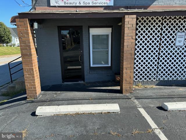 Prime commercial spa or storefront space on Pulaski Highway in Rosedale.  Perfect for small spa, retail, or office space. It offers 3 small office or treatment rooms, a waiting area, half bath and small kitchen area. Tons of parking. Excellent location with tons of visibility - close to I695, 95. and 5 minutes from Baltimore City. NNN fees are approximately $200/mo and include utilities!