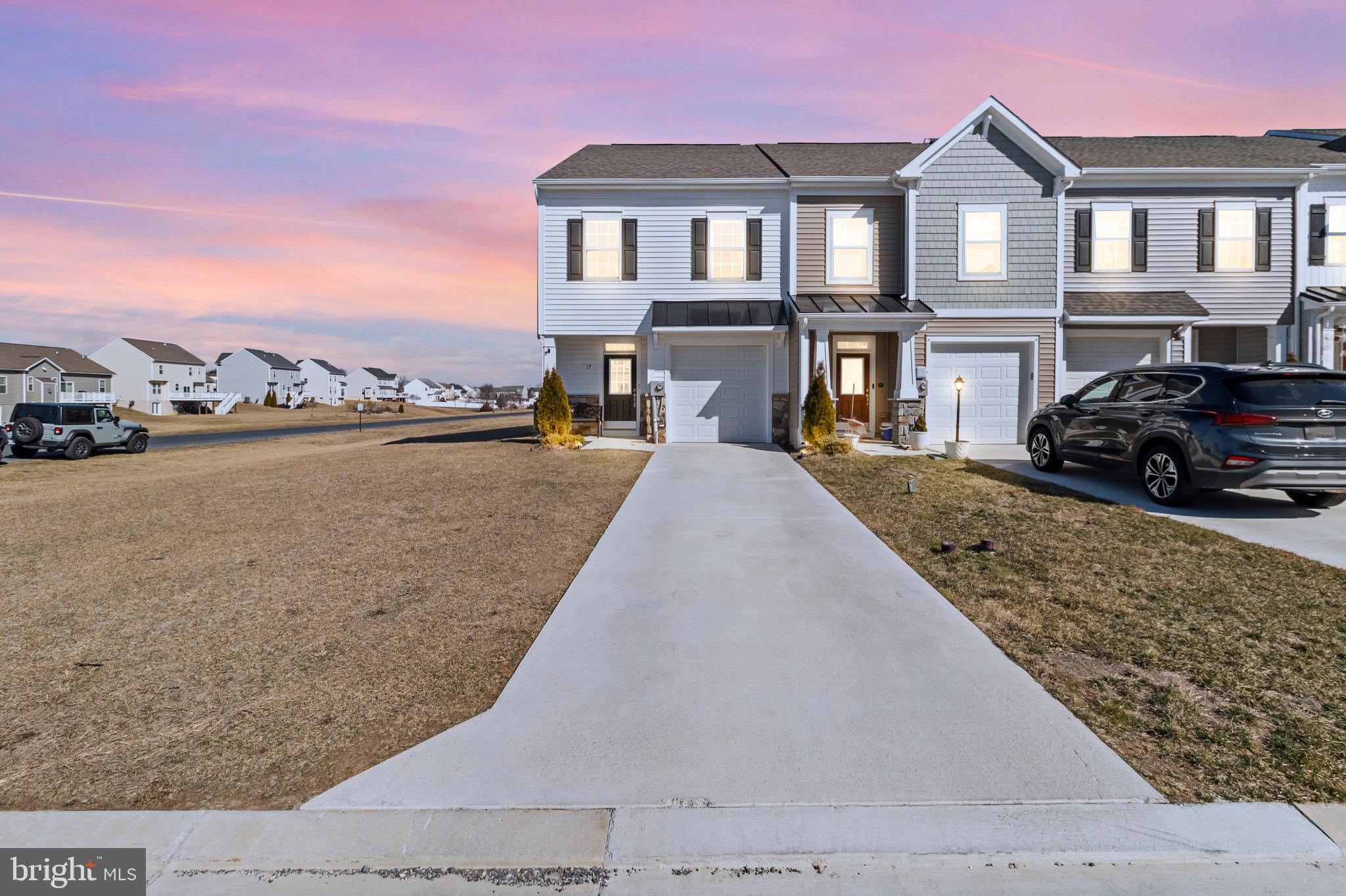 Multiple Offers Received, Highest & Best due 4/7 by 6pm. Spacious 2.5-Year-Old End-Unit Townhome in McCauley Crossing, Bunker Hill, WV. This is your chance to own a beautifully maintained end-unit townhome with garage in the sought-after McCauley Crossing community. This spacious and modern home offers fantastic features and a prime location, perfect for commuters and those who love convenience.  This home offers 9-foot ceilings on the main level, creating an open and airy feel. Large windows providing abundant natural light throughout the house. No-step entry, easy to carry groceries straight in!  Large kitchen island, ideal for breakfast, homework, or baking. This open floor plan is designed for comfortable living and entertaining. The spacious bedrooms are larger than typical townhome layouts, and breathtaking mountain views from the primary bedroom. Large patio in back that's perfect for relaxing, don't forget the oversized corner side yard for extra outdoor space.  This community is a walkable, dog-friendly neighborhood with convenient pet waste stations throughout, a concrete driveway for durability and easy maintenance. This area is booming with new businesses, such as Amazon, P&G, Food Lion, Starbucks, Tractor Supply, Wawa, Tuters Biscuit World, Popeyes, and more restaurants coming soon. Just minutes from the Virginia state line, making it ideal for commuters.