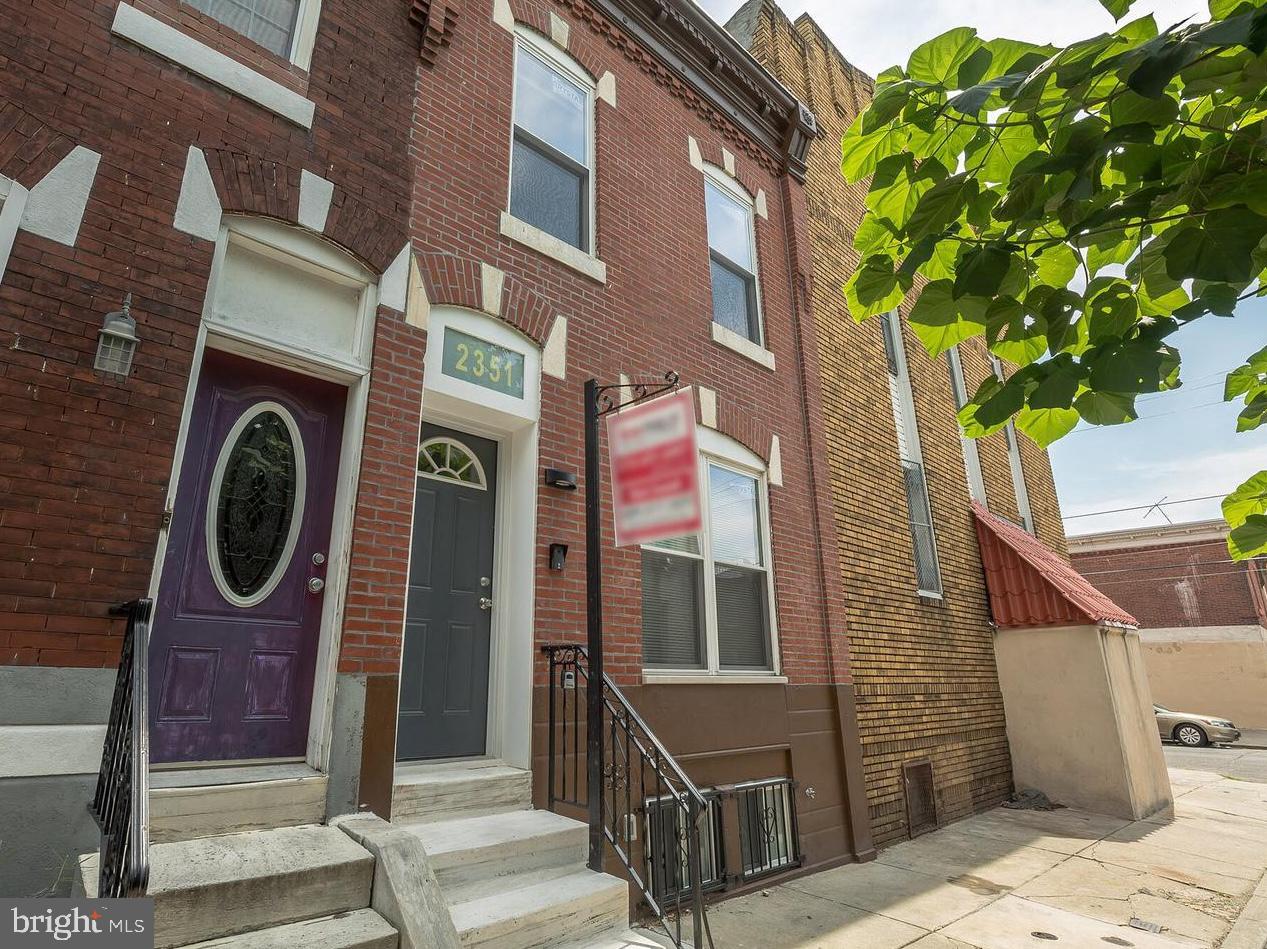 Welcome to 2351 S Marshall St, a charming 2-story row home nestled in the desirable East Passyunk Crossing neighborhood of Philadelphia. This solid masonry home offers 3 bedrooms, 1.5 bathrooms, and approximately 1,290 square feet of above-grade living space. Built in 1930, the property sits on a 15 x 48 lot with RSA5 zoning and features a full finished basement, gas hot air heating, and central air conditioning for year-round comfort. Conveniently located near public transportation, local shops, dining, and all that South Philadelphia has to offer, this home presents a great opportunity for both homeowners and investors alike. Photos are not current and were taken prior to occupancy. The property is currently occupied and remains in similar condition with personal belongings present. Please note that the property will be vacant starting in August.