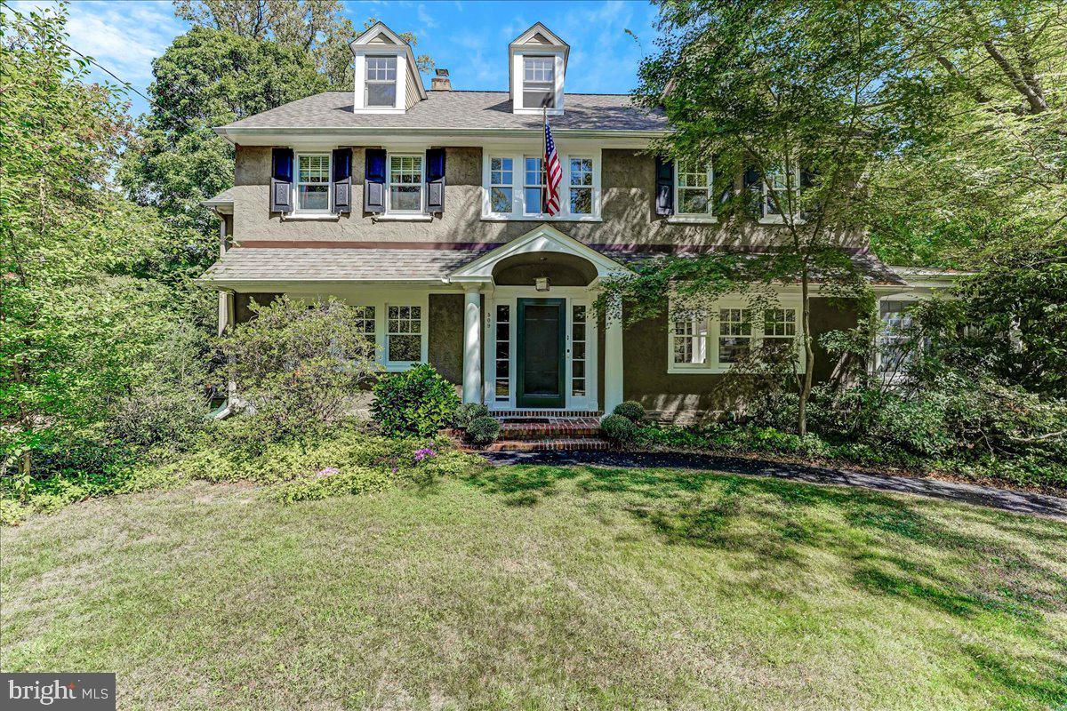 Welcome to this charming home in North Wayne, where every detail has been thoughtfully designed for comfort and style. Step into the inviting fireside living room, featuring built-in book cases and French doors that open to a sunlit sunroom—an ideal space for a home office or a cozy reading nook. The dining room provides a warm setting for intimate dinners, while the spacious kitchen, complete with a gathering space and breakfast area  is perfect for both casual meals and entertaining.  As you head upstairs the primary bedroom offers generous closet space and a well-appointed bath with double sinks and a private shower area. You'll find three additional bedrooms with large closets and hall bath. The third floor is a versatile flex space, adaptable for living, working, or additional sleeping arrangements, and includes a storage room that could be converted into an additional bath if desired. The large, flat yard is a great canvas for outdoor gatherings and enjoyment, and the home is nestled in a charming cul-de-sac that embodies the essence of Wayne. With its prime location within walking distance to the heart of Wayne, you'll enjoy convenient access to transportation, dining, and shopping. This home truly offers a blend of elegance, functionality, and community charm—ready to welcome its new owner.