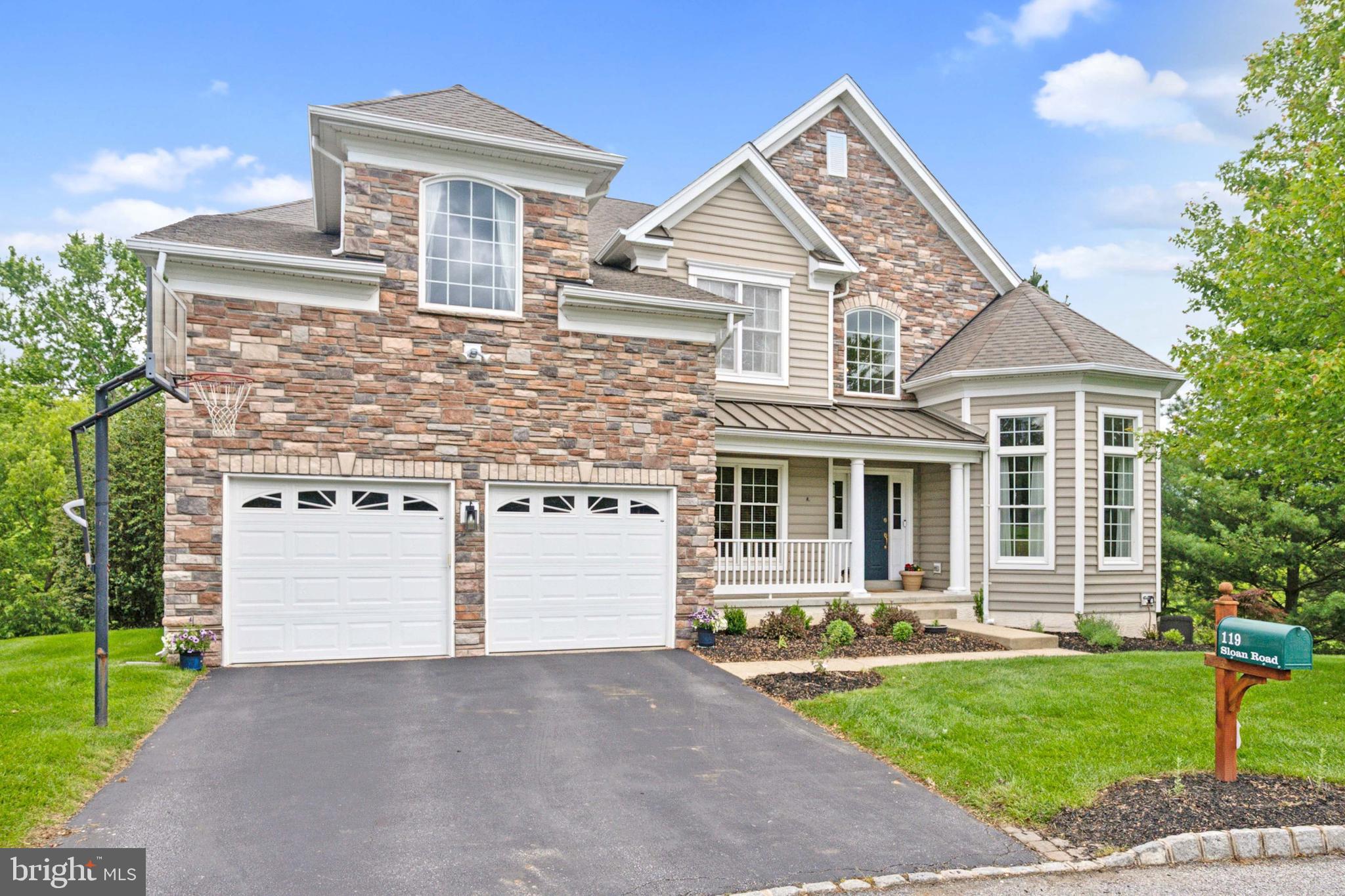 Tucked away on one of the most coveted lots in the prestigious Riverside at Chadds Ford community—backing to open space for ultimate privacy—this stunning, Victorian-inspired home blends timeless elegance with modern luxury in the award-winning Unionville-Chadds Ford School District. Boasting over 6,800 square feet of meticulously finished living space, this 4-bedroom, 3.5-bath masterpiece impresses from the start with a brand-new roof (being installed), striking stone-accented façade, professionally designed landscaping, and a welcoming front porch. Inside, a dramatic two-story foyer with hardwood floors and custom millwork sets the tone for the refined interiors, featuring an expanded gourmet kitchen with rich cherry cabinetry, Corian countertops, center island with seating, tiled backsplash, and cooktop—perfect for everyday living or grand entertaining. The main level continues with a formal dining room with classic detailing, an elegant sitting room with an octagonal coffered ceiling, a private home office, a convenient powder room, and an expansive great room anchored by a soaring stone fireplace.  A bright and airy (15 x 15) sunroom offers panoramic views and effortless indoor-outdoor flow. Downstairs, the fully finished walk-out basement is an entertainer’s dream, complete with 9’ ceilings, a custom granite wet bar, full bath, guest room, and spacious gathering area with built-in surround sound. Step outside to your private backyard oasis featuring a maintenance-free Azek deck, charming custom gazebo, and stone patio—perfectly positioned to take in peaceful valley views. Upstairs, the luxurious primary suite features a tray ceiling and a recently updated spa-like bath retreat with a deep soaking tub, custom tile and glass shower, and dual vanities. Three additional generously sized bedrooms and another full bath complete the second floor. With a newer (2 zone ) HVAC system and resort-style community amenities—including a pool, clubhouse, fitness center, tennis courts, playground, and scenic walking trails—this one-of-a-kind home is where luxury and lifestyle come together in perfect harmony.