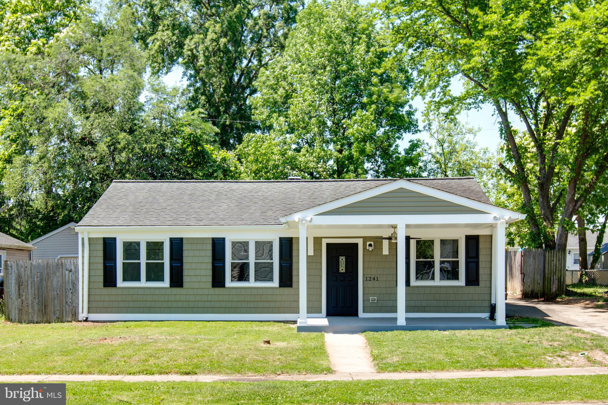 Welcome to this beautifully renovated turn-key home, where every detail has been thoughtfully updated for contemporary living. The exterior makes a striking first impression with its fresh sage-green siding, crisp white trim, and a welcoming covered front porch—perfect for morning coffee or evening relaxation. Step inside to an open-concept layout featuring gorgeous luxury flooring and a neutral color palette that creates a bright, airy atmosphere. The gourmet kitchen is a true centerpiece, boasting. The spa-like bathroom features high-end tile work and modern fixtures, offering a touch of luxury to your daily routine. Outside, the property includes a spacious yard with a privacy fence, providing a secure space for outdoor activities or pets. Located in a quiet neighborhood with easy access to local amenities, this home offers the perfect blend of style and convenience. Schedule your tour today—this gem won't last long!