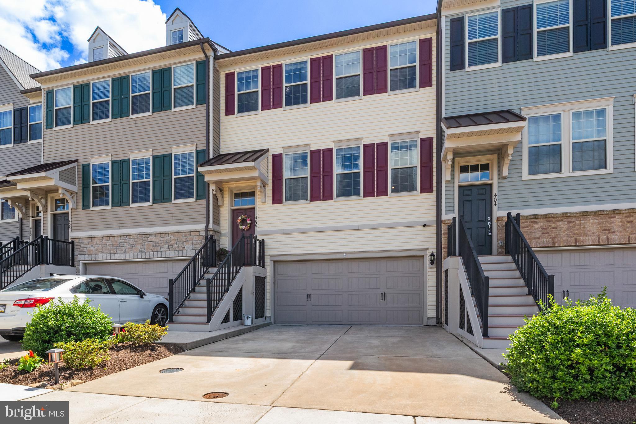 Welcome to 406 Tall Oaks Drive, Warminster, PA—an exceptional 3-bedroom, 2.5-bath luxury townhome that offers the feel of new construction with all the upgrades already in place. Built just a few years ago and loaded with high-end finishes throughout, this stunning home truly has all the bells and whistles today's buyers are searching for.

From the moment you arrive, you'll appreciate the impressive curb appeal and oversized two-car garage featuring upgraded epoxy flake flooring, enhanced lighting, and a bonus storage/workshop area. Step inside to discover a beautifully designed open-concept floor plan that perfectly blends modern style with everyday functionality.

The main living level showcases gleaming hardwood flooring, recessed lighting, and an expansive living room that seamlessly flows into the dining area and gourmet kitchen, creating the ideal space for entertaining and daily living alike. The chef-inspired kitchen is the centerpiece of the home, featuring designer white cabinetry, granite countertops, a massive center island with seating and built-in shelving, stainless steel appliances, a wall oven and microwave, gas cooktop, farmhouse sink, and classic subway tile backsplash. Just off the kitchen, a sliding glass door leads to the spacious Trex deck overlooking a large expanse of open space, providing the perfect setting for morning coffee, outdoor dining, or relaxing evenings.

A stylish powder room completes the main living level.

Upstairs, retreat to the luxurious primary suite featuring an elegant tray ceiling, an entire wall of windows that floods the room with natural light, and a spacious walk-in closet. The spa-inspired primary bathroom offers dual vanities with granite countertops and designer cabinetry, a private water closet, and a stunning floor-to-ceiling tiled walk-in shower.

Two additional generously sized bedrooms provide flexibility for family, guests, or a home office. One bedroom features neutral carpeting while the other offers attractive luxury vinyl plank flooring. The beautifully appointed hall bathroom includes a granite-topped vanity, tub/shower combination, and floor-to-ceiling tile surround. Convenient second-floor laundry adds to the home's thoughtful design.

The lower level offers a spacious family room highlighted by a wall of windows and direct access to the rear patio, which also features durable epoxy flake flooring. This versatile family room is perfect for a media room, fitness area, playroom, home office, or additional entertaining space. Multiple storage closets throughout provide abundant storage solutions.

Ideally located near shopping, dining, parks, schools, major commuting routes, public transportation, and regional rail stations, this home offers the perfect combination of luxury, convenience, and low-maintenance living.

Homes of this caliber rarely become available. Schedule your private tour today and experience everything 406 Tall Oaks Drive has to offer.