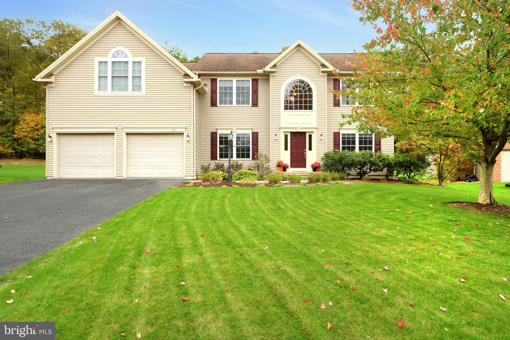 This lovely and spacious 2 story in Price's Sawmill aims to please!  With an open floorplan, sprawling hardwood throughout, big windows and tons of natural light, the layout provides plenty of space for everyone  to be together, yet separate spots to quietly relax, get to work, and to get your hobby on.  Enter into a two story foyer, which opens up into the front living room with it's gas fireplace and picture framed walls, the perfect place for a library or a music room.   The spacious dining room with chair rail molding accent accommodates large gatherings and holiday meals, while the sizable adjacent kitchen features plentiful storage in abundant cabinetry and the pantry, stainless steel appliances including a gas range, solid surface countertops, and an island with a pullout table/serving buffet.  Soaring ceilings and abundant natural light abound in the two story great room where you'll enjoy relaxing or entertaining.  Get to work in the main floor office or make it a playroom.  Upstairs you find the huge owner's suite which boasts a large walk-in closet and a spacious bath with separate shower and jetted tub, as well as dual sink vanities.  Three ample-sized additional bedrooms and a full bath complete the second floor.  Have fun playing, working out, watching the game, or taking in a movie in the lower level family room, which has a full bath also making it great for guests and sleepovers.  Need ample storage space?  You're covered in the oversized storage room complete with built-in shelving.  Outside enjoy your flat yard, the patio with a canopy, gardening beds, and the deep lot with your own treed area.  Close to parks, bike paths, schools, shopping, restaurants, and I-99 access, yet tucked away in a quiet area makes this a terrific location in the State College area.  So much to like, come see for yourself!