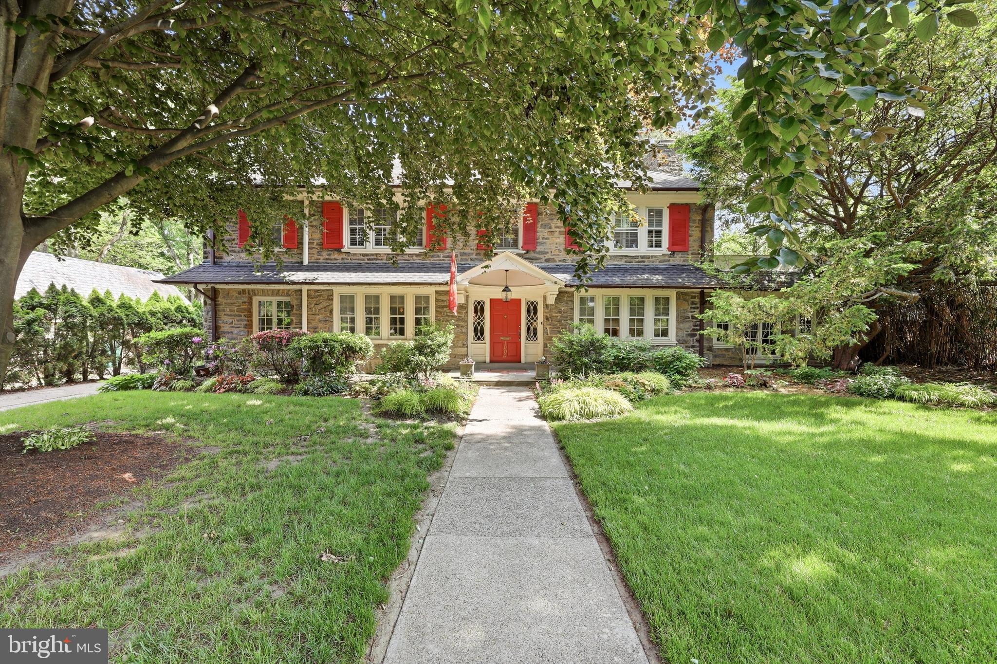 Step into timeless elegance at 1006 W Cliveden Street , nestled in the heart ofWest Mt. Airy. This stately stone colonial immediately captures your attention with its classic charm and striking curb appeal.

As you enter through the front-to-back center hall, you'll be greeted by hardwood floors, a convenient coat closet, and a powder room.  French glass doors lead to a serene patio with pavers, overlooking a sprawling, lush backyard—perfect for entertaining, gardening, or simply unwinding. Adding  to the property’s appeal is a detached two-car garage. The garage features a second floor, a blank canvas ready to be transformed into whatever suits your needs—a home office, studio, or any additional special space.

To the right of the entrance hall, the formal living room exudes warmth and character with its hardwood floors, elegant moldings, and a cozy fireplace. From here, French doors lead to a sunroom that’s nothing short of enchanting. With tile floors, its own fireplace, wall of windows, and glass doors on both sides, this space is a true retreat, inviting and offering endless possibilities for relaxation or hosting guests.
Step into this elegant dining room, where timeless details meet modern functionality.  hardwood floors and classic chair railing set the stage for memorable gatherings. To one side, a door leads to the back entryway, doubling as a convenient mudroom. On the other, French doors open to a beautifully remodeled eat-in kitchen—a chef’s dream with its hardwood floors, abundant counter space, lighted cabinet display, built-ins perfect for cookbooks, and a generous storage closet. From the kitchen, an open staircase invites you to explore the finished basement, while a door to the outside leads to a charming potting shed. This space isn’t just a room—it’s the heart of a home waiting to welcome you.

Ascend the gracefully turned staircase, framed by a stunning palladium window, and discover a thoughtful layout designed for both elegance and function. At the landing, a convenient closet awaits, but the true allure lies just beyond. Step into the gorgeous primary bedroom, where hardwood floors gleam underfoot, and French doors open to a private deck—a serene escape for morning coffee or evening relaxation. Crown molding lends a touch of sophistication, while pocket doors reveal an expansive dressing room outfitted with custom built-ins. The adjoining primary bathroom is a spa-like retreat, complete with double sinks, a large walk-in shower, and heated floors for cozy comfort.

Adjacent to the primary suite, you'll find a versatile additional space—perfect as an office or bedroom—and more custom closets. A Jack-and-Jill bathroom, featuring double sinks, heated floors, and a generously sized walk-in shower, connects to another charming bedroom, complete with three ample closets.

Continue to the third floor, where possibilities abound. Two additional bedrooms, plus a flexible office or home gym space, await, all accompanied by a full bathroom with a relaxing tub. This level offers room to grow, work, or unwind, making it the perfect complement to the rest of this remarkable home

But that’s not all—venture to the basement level, where even more awaits. This inviting space features a cozy area with sofas and a large TV for movie nights or game-day gatherings. A nearby pool table area promises hours of fun, while the large storage room keeps everything organized and out of sight. With a convenient outside exit, a laundry room, and a powder room, this lower level seamlessly blends comfort  and entertainment, 
This home combines classic architecture with modern amenities and updates, all set within a vibrant community known for its tree-lined streets and proximity to parks, shopping, and dining. It is a treasure!