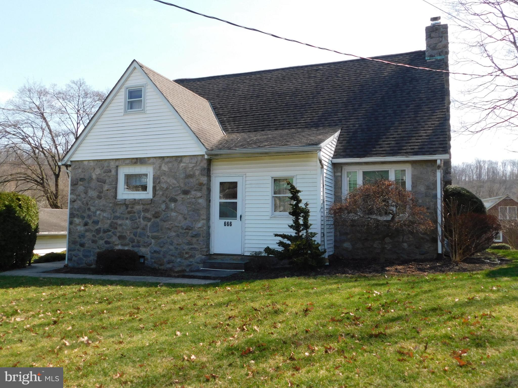 Stone Cape Cod in BASD, Located along Rt 562/S. Reading Avenue in Boyertown, this 3 BR, 1/5 BA has plenty to offer. Owner of 45 years says it is time to move on. Notice the two and a half car garage as you pull in the wide driveway. there is plenty of room for 2 vehicles and storage for your outdoor equipment as well as driveway space for 4 cars. The lot is approximately 1/3 acre with a beautiful backyard. up the outside stairs to the side entry of the house, you will first enter the kitchen. On this main level, you have the primary bedroom with a full hall bath. In the large living room is a beautiful stone-surround propane fireplace. Going to the back of the house you will come to the dining room. Many years ago this was an add-on to the house as you can tell by the original stone wall accent. Pass through the sliding glass doors to the enclosed sunroom leading to the backyard. At the very front of the house, the original porch has been enclosed and it is used as a utility/storage room. Upstairs are two secondary bedrooms and a half bath. The attic can be accessed through the smaller bedroom. There is also a small open area which could be used as a craft room or book nook. The basement is partially finished with a living area and access to the backyard, laundry facilities and a workbench. Public water and sewer.