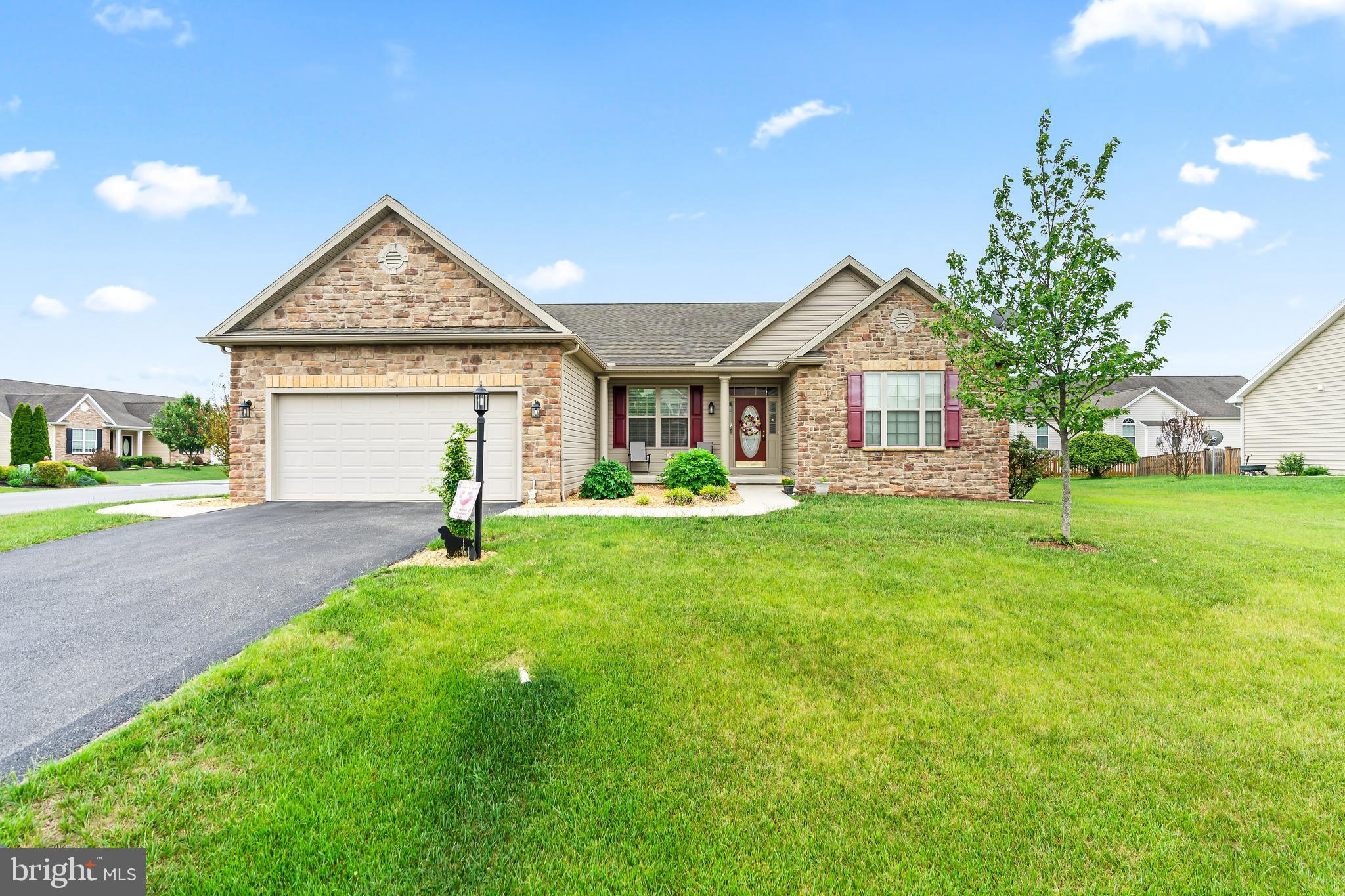 Welcome to this beautifully upgraded one story home in desirable Bridle Creek Estates—where thoughtful design, comfort, and style come together effortlessly. Expanded and customized, this 3 bed, 2 bath residence offers true main level living with the added bonus of a walk out basement and rough in for a third bath, giving you endless options for future expansion.

Upgrades and details you’ll love include rich hardwood flooring, ceramic tile, elegant wainscoting, tray ceilings, and tilt in windows for easy maintenance.

The customized floor plan features a dedicated office/den with custom built ins, creating the perfect space for remote work, hobbies, or a quiet reading retreat.

The spacious primary suite is a standout, offering a luxurious ensuite bath with a soaking tub, separate walk in shower, and a generous walk in closet. A formal dining room with tray ceiling sets the tone for memorable gatherings, while the warm and inviting living room showcases a dramatic floor to ceiling stone fireplace.

The kitchen blends beauty and function with granite countertops, quality cabinetry, ceramic tile flooring, and an easy flow to the main living areas. A main level laundry room adds everyday convenience.
Step outside to enjoy multiple outdoor living spaces, including a spacious deck ideal for entertaining and a stamped concrete patio perfect for relaxing evenings.

This home offers easy living, timeless style, and smart upgrades throughout—now ready for you to make it your own.