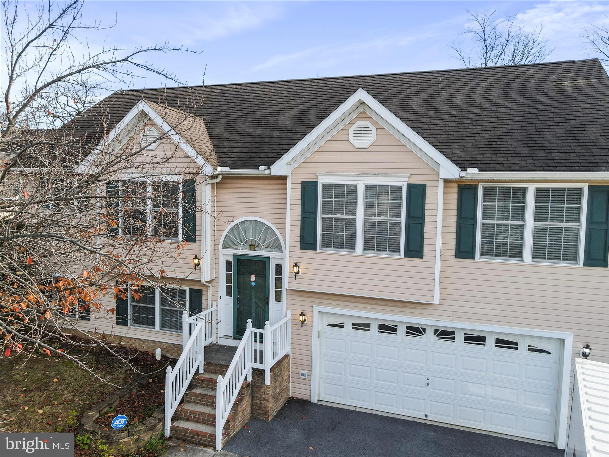 Price correction!  This charming home has plenty to offer and is located in a wonderful, well-established neighborhood!  Upon entering, take notice of the spacious kitchen with ample cabinets and counter space that flows perfectly into the living room which is adorned by skylights and doors that flow to the two-tiered, rear deck that lends itself perfectly for family cookouts and entertaining.   The house offers a nicely sized primary bedroom accented with a tray ceiling plus an adjoining primary bathroom complete with a large soaking tub and separate shower.  There are two more bedrooms and a large bathroom on the same level.   On the lowest level, there is even more space... Take notice of the recreation room complete with newly installed flooring perfect for a home gym or hobby room.  Next to it, is a finished, private room that can function as an additional bedroom, home office, or whatever your heart desires.  There is also rough-in plumbing in place for a third bathroom in the lower level.  Two-car garage, storage shed, and relatively flat yard to top it off.  All this, and it's conveniently located not too far from nearby shopping centers, schools, and Interstate-81.  Schedule your showing today!