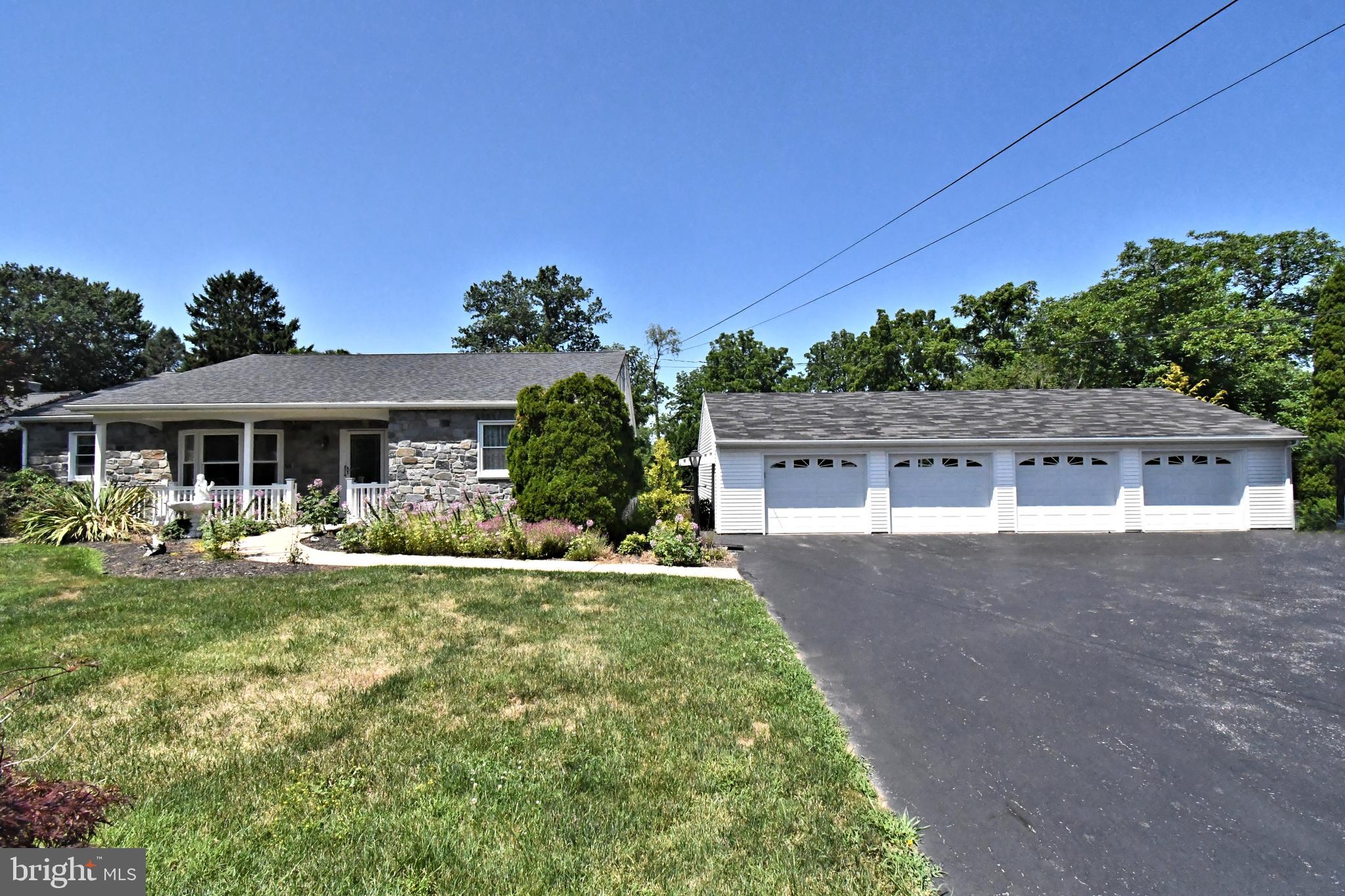 Welcome to 1207 Township Line Rd! This is a wonderful opportunity for Car Enthusiasts, Gardeners, and those just looking for abundant flex and storage space! This adorable Chester County Rancher is offering a 4 CAR GARAGE with electric and storage! So many possibilities, man cave, workshop, gym…lots of options for this one! The main house also has an abundance of flex space to work with. The main floor has a large Living area opening up to a formal Dining space with 2 Bay Windows. The Kitchen has been thoughtfully designed with hardwood cabinets, granite tile countertop and back splash, cast iron sink, and stainless appliances, with a side entrance leading out to a quiet Patio that wraps to the rear yard. There are 3 Bedrooms on the main floor for easy living and a Hall Bath with a large walk-in shower as well as a tub /shower combo. The Basement is semi-finished with multiple levels. There’s a Game Room level with Billiard Table included and ready to play, and then the lower level has even more finished space with a Family Room living area, Powder Room, and Bonus Room that was previous used as 4th Bedroom. Perfect for out-of-town guests, in-laws, office space or a teenager’s getaway. The back yard could once again be a gardener’s paradise as there is still a frame from a previous green house that could be brought back to life. Plus a shed that still has the oil heater, water and electric that was installed for the greenhouse uses. The 4-bay detached garage has a 5th rear bay overhead door to easily access from the rear yard for extra equipment. So Many Possibilities Here! HVAC and Hot Water Heater were both installed in 2021. This is being sold AS-IS and ready for its new owner(s)!