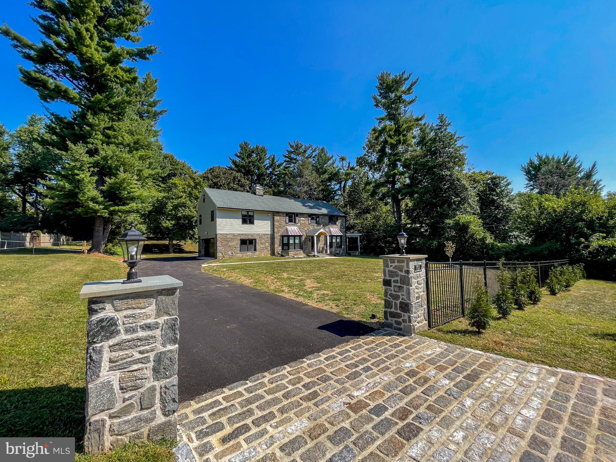 Modern elegance exudes from this completely renovated 6-bedroom, 4 full bathrooms, and 2 half-bathroom sought-after Penn Valley home in Lower Merion Township.  Sitting on a level, private, 1.04 acres, this home offers the convenience of location with a huge private backyard space, including a large, tranquil, covered patio and fire pit area.  You will immediately notice the attention to detail and gorgeous hardwood floors as you enter the 2-story foyer.  The formal living room with a wood-burning fireplace sits to the left of the entry.  To the right is the bright, spacious family room that opens to the beautiful formal dining room with wainscoting and door to the large covered porch ideal for entertaining guests.  The gorgeous chef’s kitchen does not disappoint with its large island, Quartz countertops, farm sink, and Thermador range.  Additional features include top-of-the-line stainless steel appliances, a pantry with pullout draws, a spice drawer, a wine cooler, and access to the covered back patio with a gas grill line and lush grounds.  Convenient mudroom with lockers and half bath sit between the kitchen and garage entrance.  This level also includes a bedroom/office with a full ensuite bathroom.  Ascend up the open staircase to find the sizeable primary bedroom suite with a coffee bar and wine fridge, a private balcony overlooking the fantastic grounds, a oversized walk-in closet, and a full ensuite bathroom with heated floors, 2 vanities, free-standing tub, and an oversized custom shower.  There is 2nd bedroom suite with a full bathroom, 3 additional bedrooms with large closets, another full hall bathroom with a double vanity, and a laundry room completing this level.  The finished lower level offers additional living space, ideal for a play/recreation room, 2nd finished space makes a great gym, half bath and tons of storage space.  Oversized 2-car garage with new epoxy floor.  Renovations include a new tankless water heater, new windows, and new roof, new electricity and new plumbing, and a new 2-zone HVAC.  The home is outfitted with gorgeous solid wood doors, recessed lighting, and a full-house generator.  Located in the Award Winning Lower Merion School District.  Close to schools, parks, and restaurants.  Easy commute to Conshohocken and Center City.  This completely renovated home is truly in move-in condition and is the home you have been waiting for, schedule your showing today!
