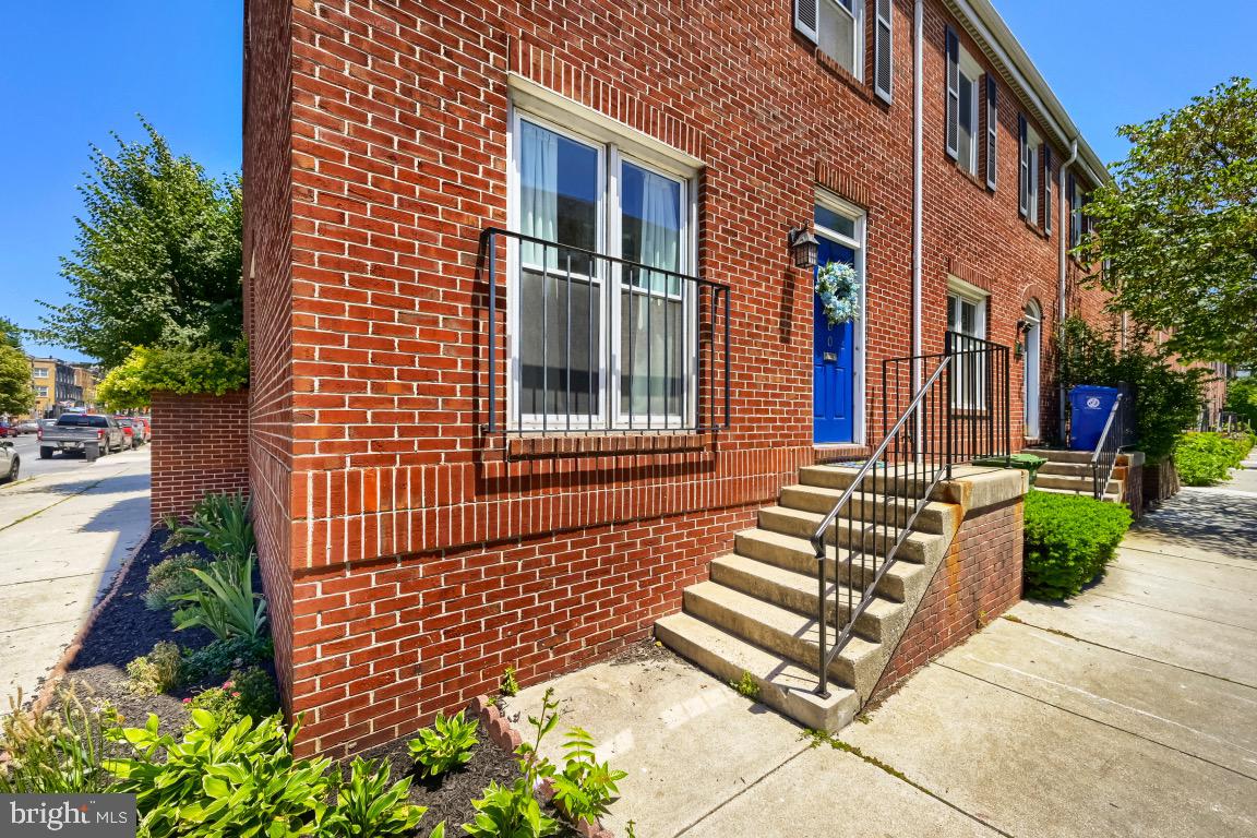 Welcome home to 2000 Aliceanna!  This gorgeous, modern end unit townhome includes an assigned parking space (#39) in a private parking lot, exclusively for only its owners and their guests. All guests are welcome to park on first come first serve basis (with a valid parking pass) within this private lot, located directly behind the homes. This freshly-painted home is part of a small HOA called Washington Square, nestled in historic Fells Point and located across the street from the scenic Baltimore harbor and its swirling walking path.  The HOA maintains common space landscaping and handles snow removal for its residents (including the parking lot). “Location, location, location!” runs true with this beautiful home being across the street from the scenic Baltimore Harbor, only mere steps away from Canton and of course, a stone’s throw to the Fells Point’s restaurants, shops and Broadway Market.  The minute you stroll into the foyer the half bath greets you across from a large coat closet.  In the foyer and throughout the home, glide across gorgeous oak floors.  On the main level, you will enjoy the harmonious lifestyle of open concept living in this renovated home.  The elevated kitchen design features a geometric patterned backsplash, custom white beadboard shaker cabinetry, eye-catching Mullin glass doors to showcase signature glassware, a breakfast bar overlooking the dining space, stainless steel appliances, a chic gooseneck faucet and lastly, sleek hardware.  The dining room hosts an illuminating Edison bulb light fixture, powered by a soothing dimmer and custom plantation shutters, all added in 2018.  The living room features a potential office nook space close to the 3 doors that showcase not only more sunlight, but also the well-manicured garden and back patio leading to your personal parking space (and open guest parking with a pass), behind your newly-stained wooden gate.  This patio, which also has a large outdoor closet, creates a simple space for grilling with close proximity to the kitchen.  From the main level, you’ll step unto freshly-painted risers on a completely open staircase with stained oak threads.  Inside the owner’s suite, the primary bedroom, engulfed in natural light, features spacious dual closets.  In the owner’s bathroom, experience the soothing Zen effect of cream and slate in your primary bathroom, newly-updated with its gorgeous quartzite countertop, new hardware and matching mirror and cabinetry.  Down the hall, the guest bathroom, right next to the second bedroom, has a brand new mirror.  Conveniently located between both bedrooms on the second level bedroom sits the LED certified/ENERGY STAR stainless steel washer and dryer, tucked behind the laundry closet’s accordion doors.  Above this, the lofted bright third level features an open concept potential third bedroom, doubling as a flex space for the owner who needs a bright and airy room for work or working out, entertaining, etc.  Natural light floods this well-light space that opens up to a spacious rooftop area, perfect for sunny days and cool nights with friends and family.  This fantastic Fells Point home features the following from 2019: HVAC (both indoor and outdoor units), hot water heater, washer and dryer and a total asphalt roof replacement in 2015.  A stunning renovated end unit townhome with parking, juxtaposed between Fells and Canton, a block up the water is certainly not something that comes around often and we look forward to seeing you book your private showing today!