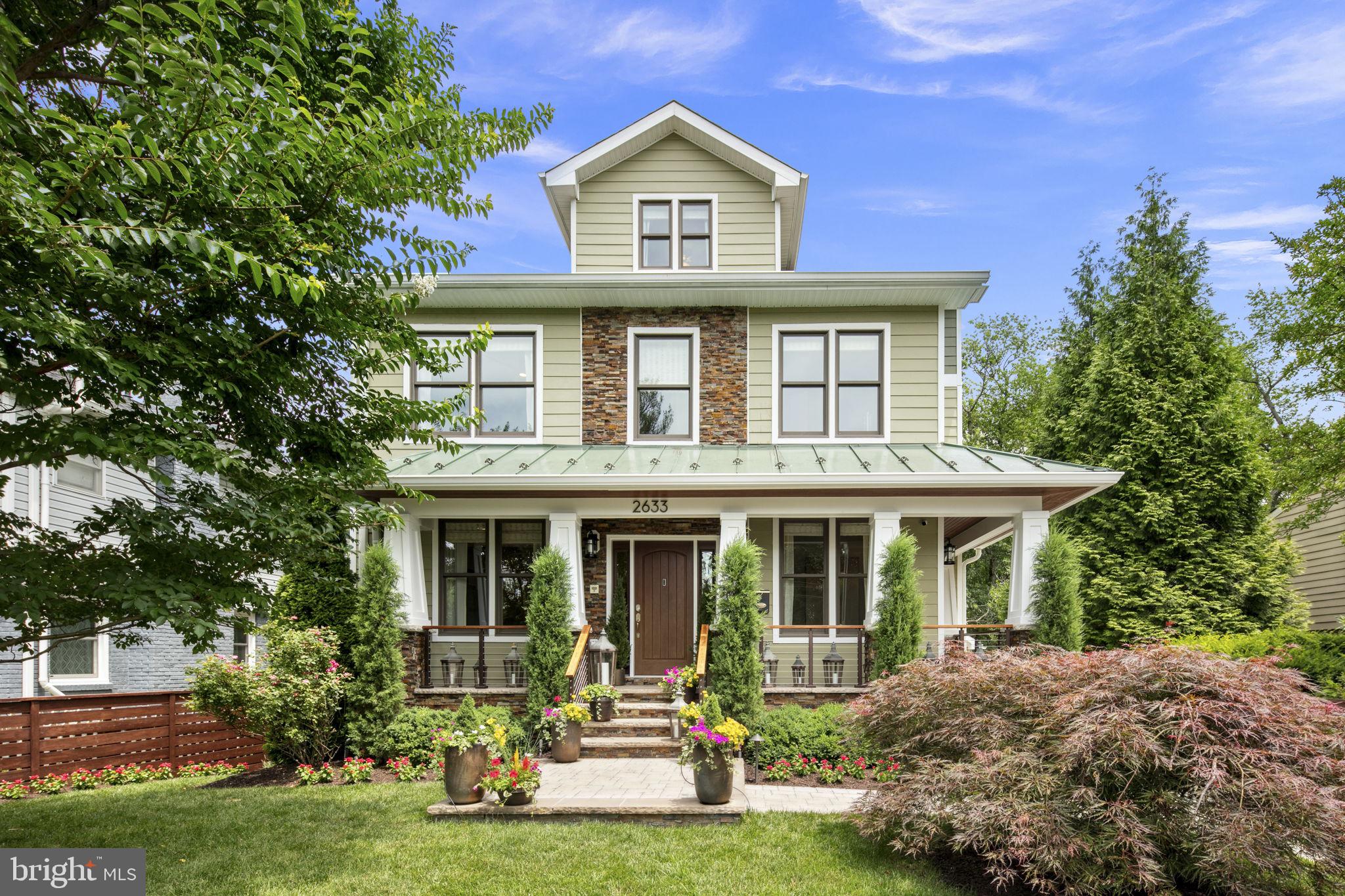 Welcome to this exquisite and meticulously maintained, light-filled custom-built hilltop Craftsman in the sought-after Milburn Terrace neighborhood in the Yorktown HS district! This stunning home exudes quality and sensibility with its 5 Bedrooms and 4.5 Baths, approximately 4650 total square feet on 4 levels, with tree-top views. Built in 2014 and updated in 2021, with loads of Smart Home features and top-of-the-line upgrades by a professional interior designer
including new white oak hardwoods, Arhaus and Restoration Hardware lighting, custom high-
end window treatments and neutral paint colors. As you enter the home, the entry foyer leads
to a study and separate reading room or den, a formal dining room with custom wainscoting and
a powder room. The upgraded gas-cooking gourmet kitchen with stainless Viking Professional
appliances opens to a dining space and living room with floor-to-ceiling gas fireplace that leads
to a Trex deck that overlooks the lush, private, professionally landscaped yard and meticulously
maintained back patio with lighting and a spa, great for outdoor gatherings or relaxing. The
luxurious Owner’s suite on the 2 nd floor includes a huge walk-in closet, and Owner’s Bath en
Suite with Grohe faucets and fixtures, stand-alone soaking tub, custom built-in shelves,
separate oversized frameless glass door shower with white porcelain subway tile, and dual
vanity sink. The two additional bedrooms on the 2 nd level with walk-in closets share a bathroom
with dual vanity and tub shower. The third floor provides two more bedrooms with walk-in-
closets and a shared lounge loft space and full bath with tub shower. The walk-out lower-level
living space has beautiful heated ceramic floors, an electric fireplace, a kitchenette with full-
sized refrigerator, gym, media room with a high-end sound system, bonus room, storage space,
and full bath with beautiful custom tile and stall shower. Two custom Anderson sliding glass
doors lead to a private patio with covered space with ceiling fan to create the perfect oasis for
entertaining and lounging. This home offers a detached two-car garage with a loft space with
electricity that could be converted to more living space or remain as extra storage. You must not
miss this spectacular home with quality finishes and tons of versatility and usable space.

Conveniently located a few blocks from Yorktown High School and Greenbrier Park with a
running track, baseball fields, basketball and tennis courts, and community aquatic center. Also
steps from Chestnut Hill Park and Playground, close to Donaldson Run hiking trail, an
abundance of shops, restaurants and grocery stores and EZ access to Chain Bridge and Route
66.