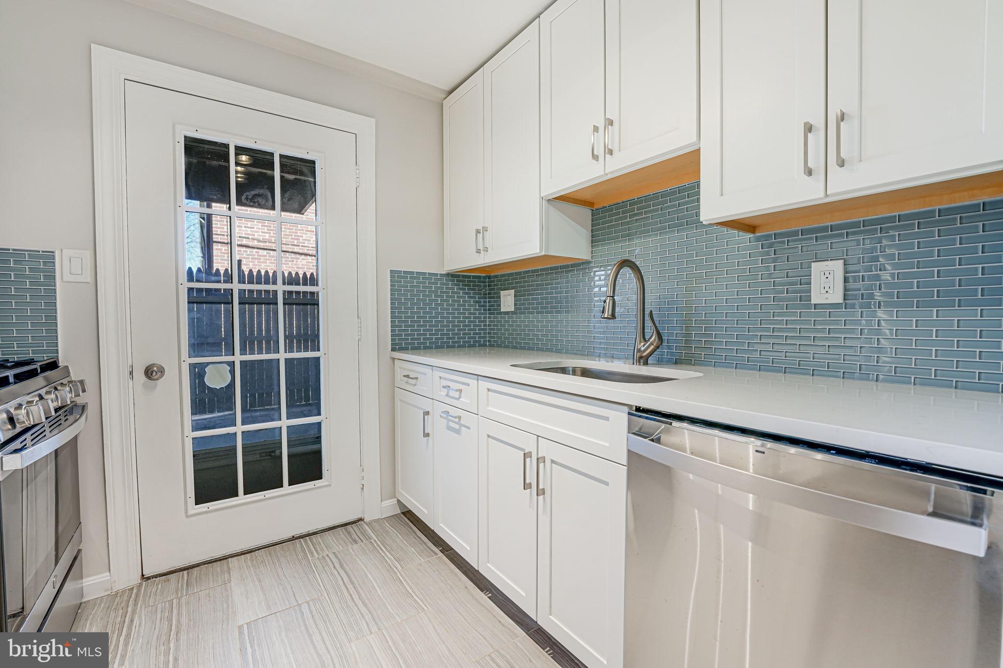 **Incredibly rare opportunity for a HUGE private patio in Arlington Oaks!** While the vast majority of properties in the community do not feature outdoor space of any kind, this beautifully renovated condo includes a spacious and partially covered rear patio (fully fenced with a gated rear entry)!  In addition to the unique opportunity for outdoor space, this lovingly maintained property received extensive renovations in 2023 to include: a BRAND NEW Kitchen with all new white Waypoint Shaker cabinetry, Quartz countertops,  charming Glazzio backsplash tiling, new under mount sink, new faucet, new garbage disposal, new outlets and switches, new lighting, and all quality GE stainless steel appliances (complete with an air fryer and convection option within the oven, a bonus middle burner on the stove, and a dishwasher with a steel tub for added soundproofing).  Also in 2023: a FULLY RENOVATED bathroom which included gutting the prior bathroom to the studs and installing new drywall, new baseboards, and a new door in addition to all new fixtures, all new faucets, tasteful shower and tub tile surround to the ceiling, the addition of a shower niche, gorgeous Merola floor tiling, an upgraded 60" soaking tub, a new Waypoint bath vanity, Quartz countertop, Kohler toilet, a recessed medicine cabinet, new lighting, and all new hardware.  Other notable dates and upgrades: Brand New Entry Door and All New Door Trim (2023), Hardwood Floor Refinished (2025), Fresh Paint Throughout (2025), Upgraded Interior Door Hardware (2025), New Lighting Fixtures (2025), New Double Pane Vinyl Windows (2009), and so much more.  This unit offers the new owner an option to secure 2 permanent parking passes, 2 hanging visitors passes, temporary guest passes, the option to rent additional storage onsite, bike storage, a community gym, and onsite laundry (within the courtyard).  Don't miss your chance to own this well loved home!