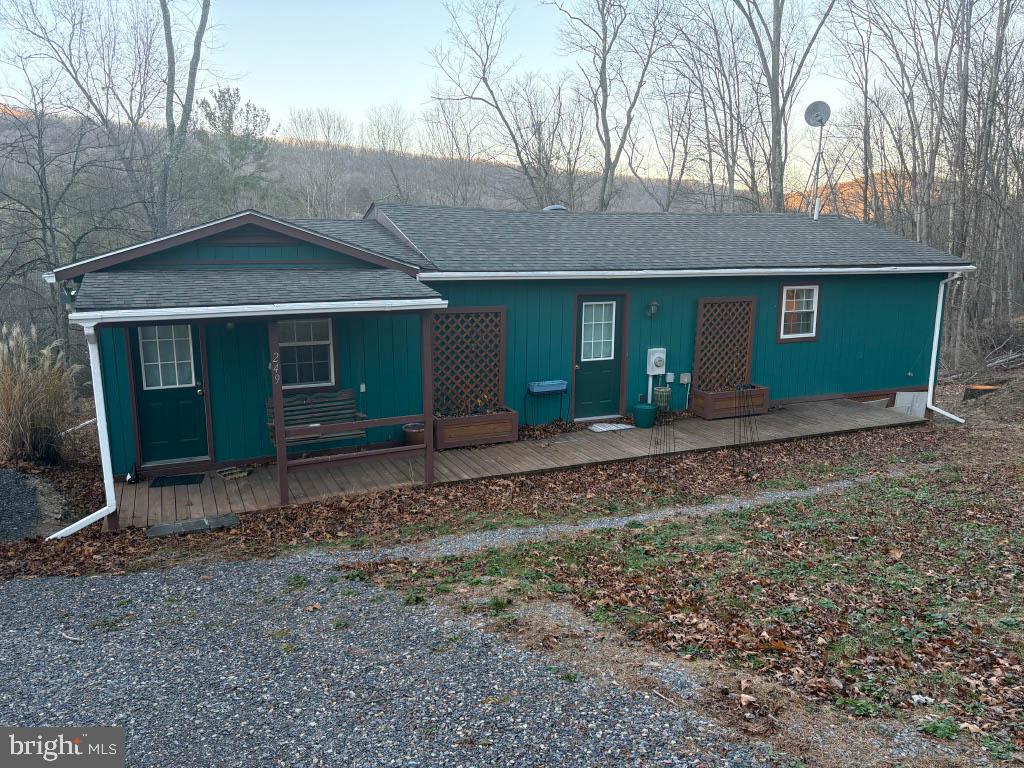 Discover tranquility and modern comfort in this beautifully furnished 2-bedroom, 1-bathroom home offering 1,100 sq ft of inviting living space on a serene 2.42-acre lot nestled within the George Washington National Forest. Just minutes away from the Trout Pond Recreation Area, the property blends privacy, convenience, and natural beauty.

The property features a large open-concept living room, dining room, and kitchen, ideal for entertaining or cozy evenings at home. The fully furnished kitchen includes all the basics, including pots and pans, utensils, and everything you need to make yourself at home, as well as a separate chest freezer for long-term storage. The cozy living room features an electric fireplace as well as air conditioning for summer months. The newly refurbished bathroom features modern finishes, while the generous master bedroom includes a comfortable queen bed and ample storage. A versatile guest room with a twin futon welcomes visitors or can serve as a lounge or hobby space. Further, a separate home office space provides the perfect work from home space, with high-speed fiber internet throughout the home. A stacked, full-sized washer and dryer unit adds everyday convenience. The house also features a whole-home water filter, with filter changes managed by the property manager.

Outside, enjoy nearly 2.5 acres of wooded privacy with direct access to nature, with yard maintenance fully included. Nearby are the Trout Pond Recreation Area and Lost River State Park, offering swimming, hiking, fishing, and year-round outdoor recreation. Despite its secluded setting, the home is conveniently located near the restaurants, shops, and local businesses of Lost River, Mathias, and Wardensville, providing a perfect balance of solitude and accessibility.

Whether you’re seeking a peaceful retreat or a ready-to-enjoy mountain home, this charming property offers the best of West Virginia living.