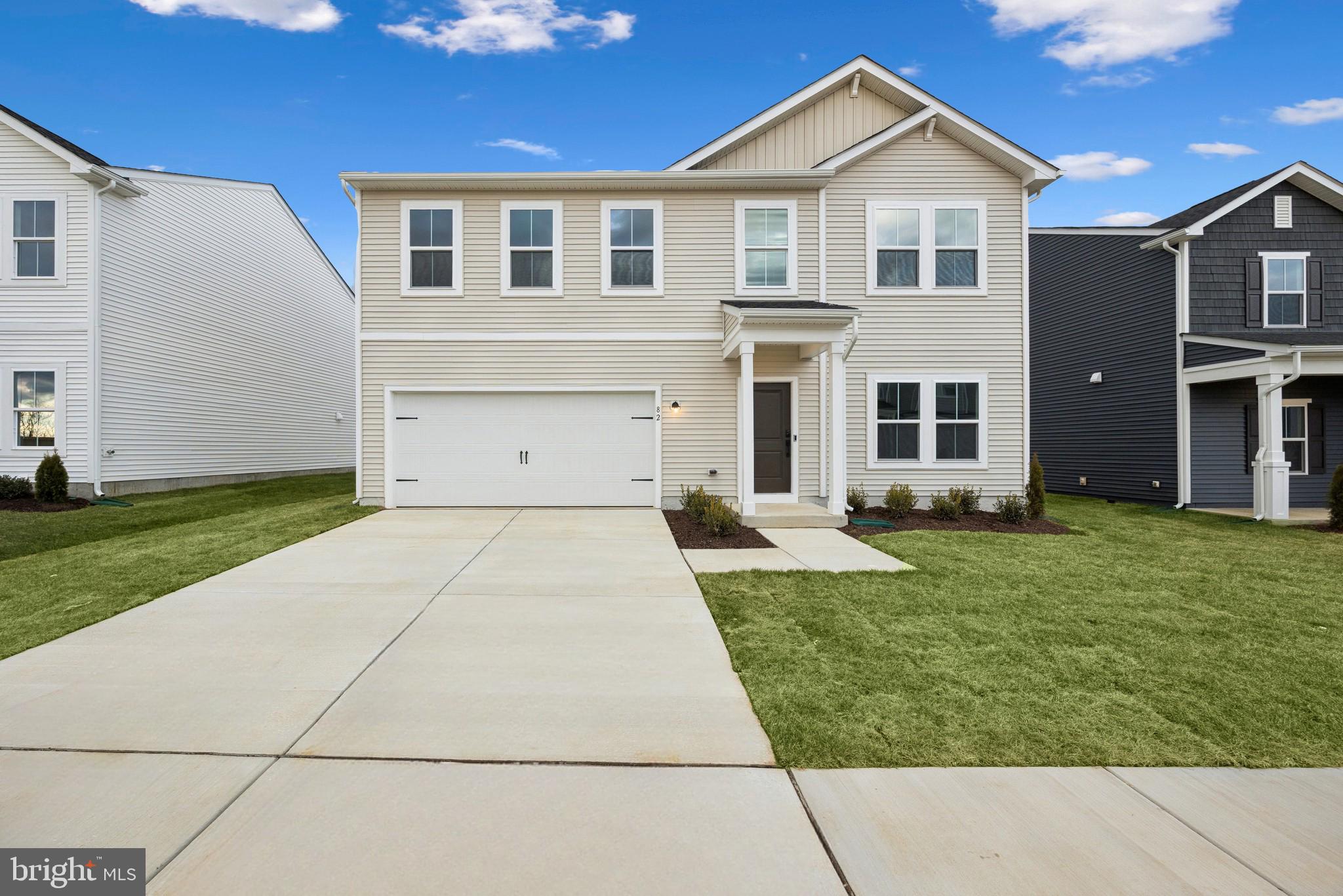 IMMEDIATE MOVE IN-why settle, when you can have peace of mind with a brand-new home?!  Welcome home to the Water Lily, a stunning 5-bedroom, 3-bath home designed with modern elegance, comfort, and functionality in mind. The main level features an open flexible living space perfect for additional living space or work-from-home needs. Enjoy an open-concept kitchen complete with a center island that flows seamlessly into the dining area and spacious family room, ideal for everyday living and entertaining. Additionally, you will find an extra bedroom and full bath on the main level, ideal for guests, in-laws, or private office! The upstairs includes a central loft area, 3 secondary bedrooms, laundry room and spacious Primary Bedroom. This home also features our designer curated Farmhouse Look which includes 42” staggered upper cabinets and floating shelves, adding a sense of charm and providing a unique space to display your favorite decor or dinnerware. A Farmhouse white apron front sink completes the modern Farmhouse Look along with sleek seamless Quartz kitchen countertops and stainless-steel appliances. Vintage inspired lighting, rustic main level flooring, and farmhouse finishes complete the Farmhouse charm throughout the home. The Water Lily at Huntwell West is conveniently located within minutes from shopping, dining, and outdoor adventures. Explore nearby gems like Historic Harpers Ferry, Historic Shepherdstown and Downtown Charles Town, just minutes from Hollywood Casino at Charles Town Races. Enjoy close proximity to commuter routes to Washington, D.C., Frederick, MD, and Northern Virginia. Call today to schedule your private tour! Ask about our closing costs assistance with KHovnanian American Mortgage. **Photos are of a decorated Oleander Model Home and similar home/features and may not reflect current home finishes. Pricing, options, and promotions are subject to change without notice.
