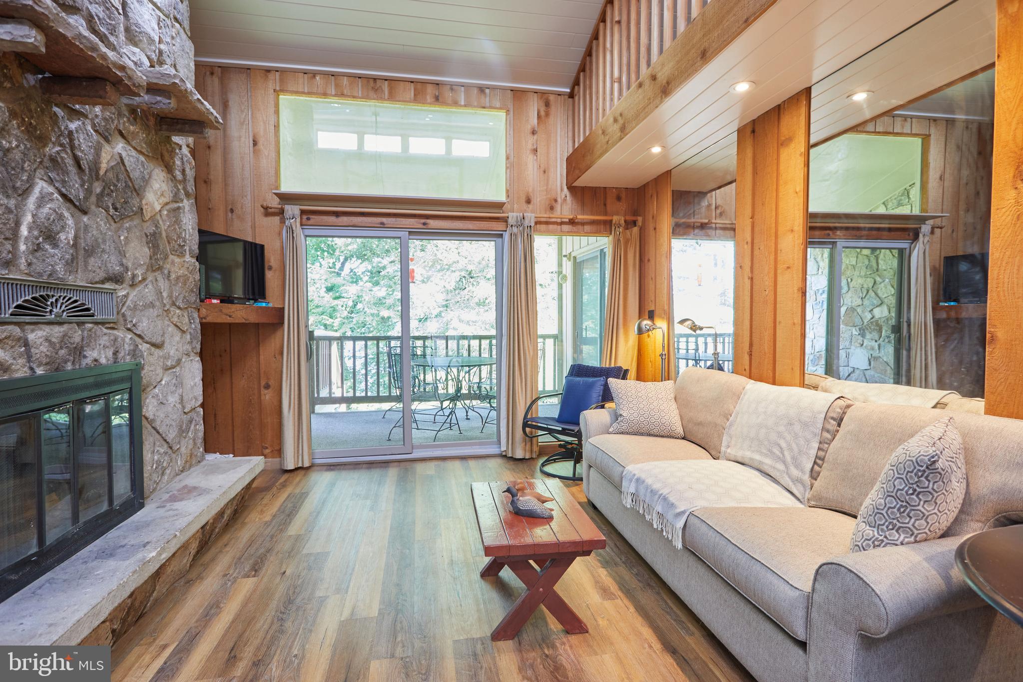 Ultimate lakefront living awaits at Red Run! This stunning 2-3BR, 2BA condo features a second-floor loft and a versatile den easily used as a 3rd bedroom. Enjoy breathtaking lake views from your gorgeous primary suite and private lakeside balcony. Extensively upgraded with a extensively upgraded kitchen boasting granite countertops and soft-close cabinetry, a newly remodeled laundry room with a new water heater and sink, an upgraded electrical panel, and premium cement-backed luxury vinyl plank flooring for ultimate durability. Stunning new shiplap ceilings with recessed lighting illuminate the freshly painted main living spaces, complete with a cozy wood-burning fireplace. Includes an assigned deep-water boat slip, outdoor storage, and access to 11 acres of incredible amenities: a heated pool, tennis courts, playground, kayak racks, and a stone fire pit. Major community updates include a new metal roof and resurfaced courts. Just minutes from downtown Oakland, Garret Cinemas, and shopping!  Seller  will sell his 2011 Sea Ray 195 with 4.2 L EFI engine for $4500.00    OBO "As=Is " see photos and dock slip