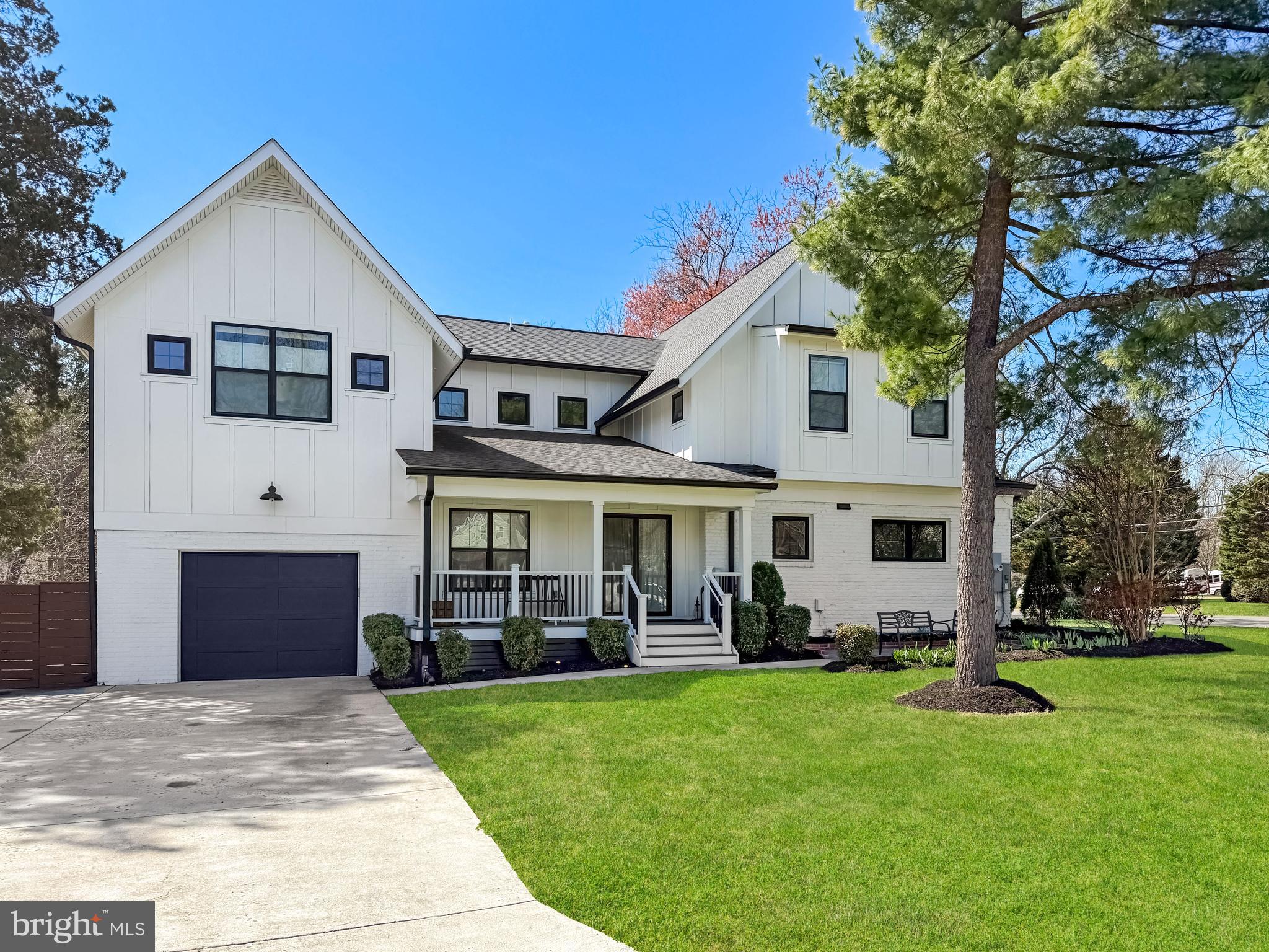 **Check out the 3-D virtual tour and floorplans!** Welcome to 1501 Shenandoah Drive, a stunningly updated and practically re-built farmhouse-style home sited on a beautiful corner lot in Alexandria’s sought-after Hollin Hall Village. Crafted Architecture and WFB construction collaborated to create a showplace! This lovely 6-bedroom residence welcomes you with a stone patio and charming covered porch, while the vibrant landscaping adds great curb appeal. Thoughtful design and craftsmanship shine throughout. There are soaring 9-foot ceilings on the main level, tons of recessed lighting, and the contemporary open floorplan makes for easy living! Unique windows, dazzling hand-scraped wide-plank floors, lots of custom built-ins, architectural barn doors, stylish lighting fixtures  and oil-rubbed bronze doorknobs and hinges add a classy feel. The main level includes a bedroom and full bath plus a separate powder room. The spectacular chef’s kitchen features modern white cabinetry, a huge island with barstool seating, premium counters, a sleek tile backsplash and deep farmhouse sink. There’s a commercial 6-burner Bertazzoni stove, refrigerator and dishwasher in addition to the microwave drawer and wine fridge. Just off the kitchen is the perfect family room with its soaring ceiling and classic fireplace framed by a shiplap wall with built-in shelving. Even the laundry/mud room is special in this home with lots of storage, the laundry chute and a utility sink. Walk out to the large deck ideal for easy entertaining! The upper level has 5 bedrooms and 3 full baths. The owner’s suite enjoys a massive walk-in closet with professional organizers in addition to a spa-like bath with custom tilework in the oversized shower and a free-standing deep-soaking tub. On the lower level, you’ll find a spacious rec room with built-in banquette seating and a tv area with a shelving surround plus lots of storage. This amazing property has it all and  is perfectly located near everywhere you’ll want to be! It is super-close to Hollin Hall shopping center which includes unique shops & restaurants, a bakery, grocery store, pharmacy and more. Also close by are Old Town Alexandria, the picturesque Mt. Vernon bike trail that runs from DC to Mount Vernon Estate, playgrounds, baseball fields and a park. The GW Parkway, the Pentagon, Joint Base Anacostia Bolling, Fort Belvoir, Amazon HQ2, Belle Haven Country Club & Mount Vernon Park Association are all a short distance away too.