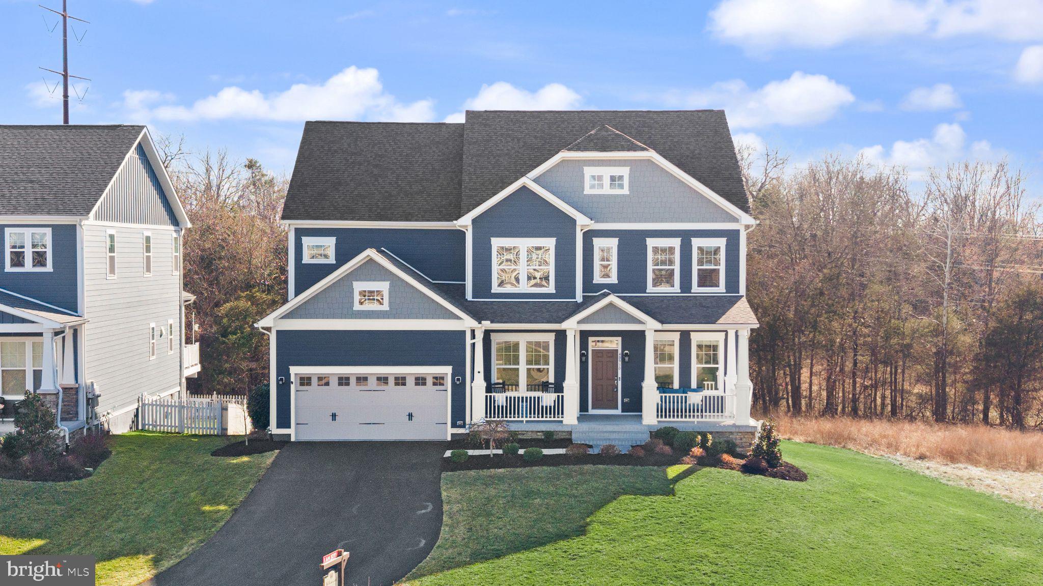 A rare opportunity to own a beautifully upgraded home in the highly desirable Greens South at Willowsford. This stunning Beazer Brighton floorplan offers light-filled spaces, thoughtfully designed living areas, and private treed views backing to the Willowsford Conservancy—creating a home perfectly suited for both elegant entertaining and everyday comfort.

The open-concept main level is filled with natural light and centered around a beautiful gourmet kitchen with a large island—ideal for gathering with family and friends. Just beyond, the bright sunroom provides a peaceful space for morning coffee, while the formal dining room, connected by a convenient butler’s pantry, creates the perfect setting for hosting memorable dinners.

The spacious family room with cozy fireplace invites you to relax and unwind, while the renovated private office offers a stylish and quiet work-from-home retreat. A practical mudroom off the two-car garage helps keep everyday life organized.

Upstairs, the spacious primary suite serves as a peaceful retreat featuring a luxury bath and custom walk-in closet. Three additional generously sized bedrooms and two full baths complete the upper level, including a Jack-and-Jill bath with elegant board and batten detailing.

Additional upgrades include custom window treatments, ceiling fans, freshly painted doors and hallway, whole-home sound system, and a whole-home humidifier.

The walk-out basement expands the living space with a large recreation room, wet bar, and new refrigerator (2025), along with a bedroom and full bath—perfect for guests or extended stays.

Outdoors, enjoy private treed views backing to the Willowsford Conservancy, along with a new fence, sprinkler system, and energy-efficient solar panels helping reduce utility costs.

Located in the award-winning Willowsford community, residents enjoy resort-style amenities including pools, clubhouse, fitness center, lakes, fishing ponds, splash park, zip line, tree houses, community events, and the beloved Willowsford Farm. Conveniently located near Dulles Airport, shopping, restaurants, vineyards, and major commuter routes.