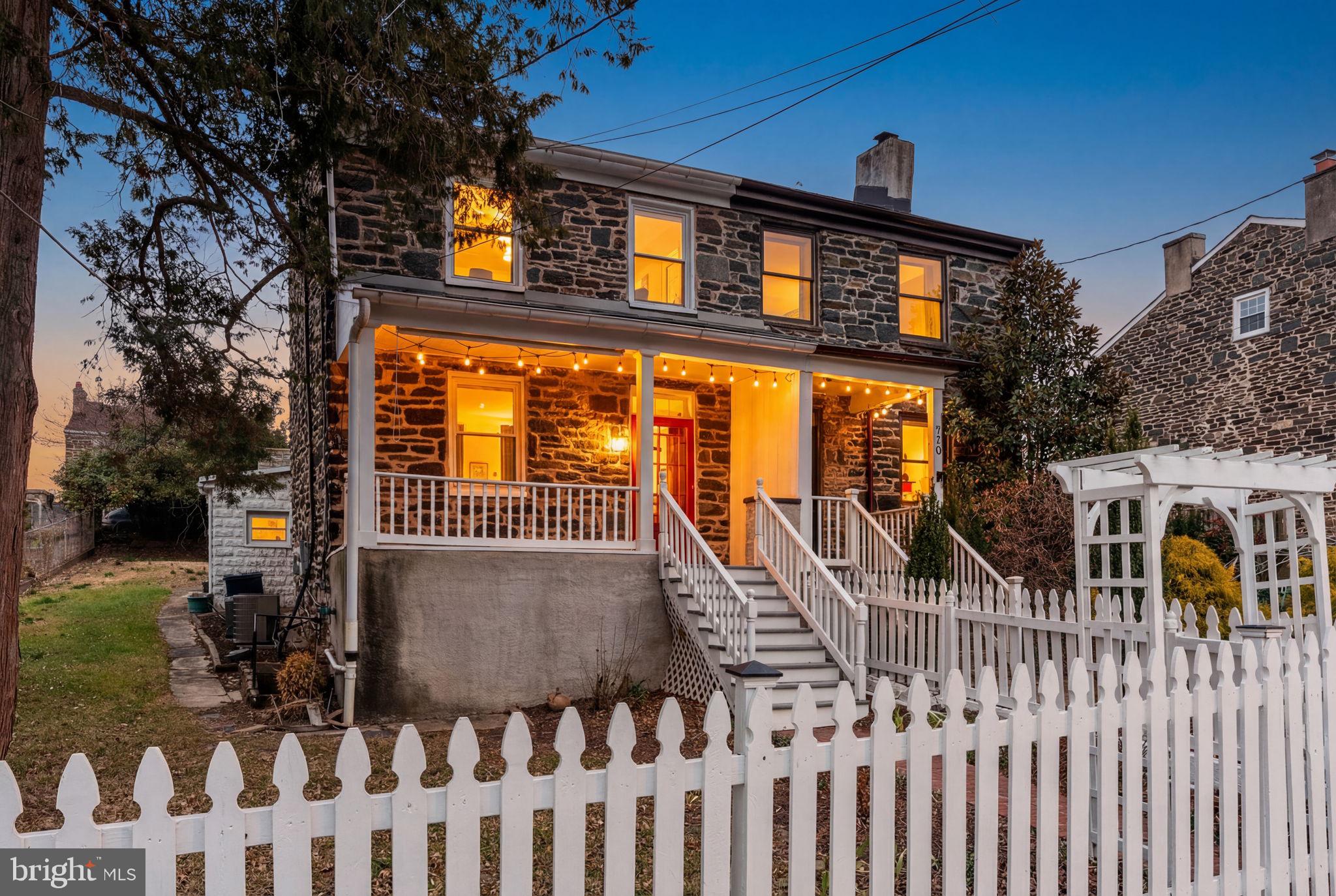 Welcome to 712 Pacific Street! A rare offering within the coveted Stone Hill Historic District. This lovingly restored granite home offers a unique blend of authentic 19th-century character and carefully considered modern improvements. Originally constructed in the late 1840s as housing for Hampden mill workers, Stone Hill remains one of Baltimore’s most intact and charming historic enclaves—defined by granite façades, tree-lined streets, and a close-knit village feel elevated above the surrounding city.

A classic white picket fence and arbor frame an unusually large front yard, leading to a welcoming porch and sun-filled enclosed sunroom—ideal for relaxing year-round. Inside, original pine floors, a fireplace, and generously proportioned living and dining spaces reflect the home’s historic roots while offering comfortable, everyday living. The updated kitchen features soapstone counters, an induction range, and a cozy breakfast nook perfect for casual meals or morning coffee.

The upper levels include two bedrooms on the second floor and a spacious third-floor bedroom. Both full baths have been renovated (2025), complemented by fresh interior paint and new carpeting throughout. Recent improvements also include a fully repointed exterior and a new main roof, providing peace of mind for years to come.

Additional highlights include a rear garage ideal for storage and a full-height waterproofed basement with excellent potential for future finishing, studio space, or workshop use. Located just moments from the shops, dining, and amenities of Hampden, this special property offers a rare opportunity to own a piece of Baltimore history in a neighborhood that has maintained its character for nearly two centuries.