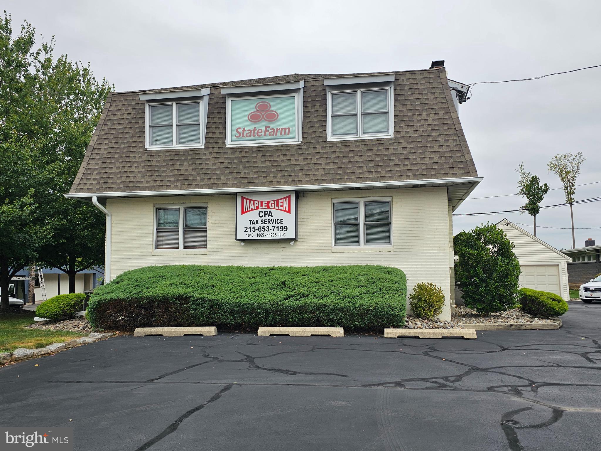 Meticulously maintained office building in Maple Glen.  Awesome location on Rt 63 (WELSH RD) with excellent exposure to an abundance of traffic. Huge illuminated sign awaiting your very own marque. This property was used as a Real Estate Office for the past 50+ years.  Second floor currently rented to a State Farm Insurance Agency. This property is in move in condition featuring multiple offices on first floor with a reception area and one rest room.  Second floor features a huge open area, one large office a small kitchen and a restroom.  Full basement for storage. Three car garage, new roofing (2021) on all buildings. New central air conditioner with heat on second floor. Gas heat and central air on first floor (compressor replaced 3 years).  Large parking lot, perfect location for another real estate office, title company, medical, restaurant or professional use. Great for a contractor's office building. Located on Rt 63 between Limekiln Pike and Norristown Rd. Owners are former Real Estate Broker and agent. 24hrs+ notice to show property