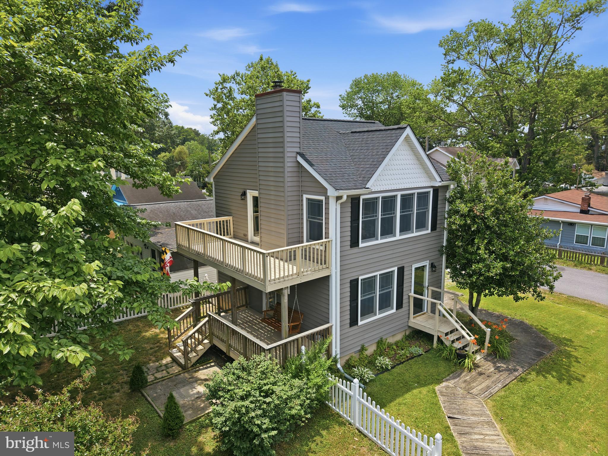 Discover your waterfront retreat with Chesapeake Bay views, community water access, and an ideal location for both everyday living and weekend escapes. The stunning upper-level living area features vaulted ceiling, a classic wood-burning fireplace, and beautiful hardwood flooring that creates a warm and inviting atmosphere. Large, upgraded windows fill the home with natural light while showcasing picturesque Bay views from multiple vantage points.
Designed for entertaining and outdoor enjoyment, the property offers multiple spacious decks and a fully fenced backyard, perfect for gatherings, pets, or simply relaxing outdoors. Enjoy the best of coastal living with community amenities just down the street, including a pier, beaches, playgrounds, and direct water access for kayaking, fishing, and enjoying the Chesapeake Bay lifestyle.
Recent improvements, including a newer roof and siding, provide added peace of mind, making this home truly move-in ready. Conveniently located approximately one hour from Washington, D.C., and just 50 minutes from Annapolis, this exceptional property offers the perfect balance of waterfront tranquility and commuter convenience.