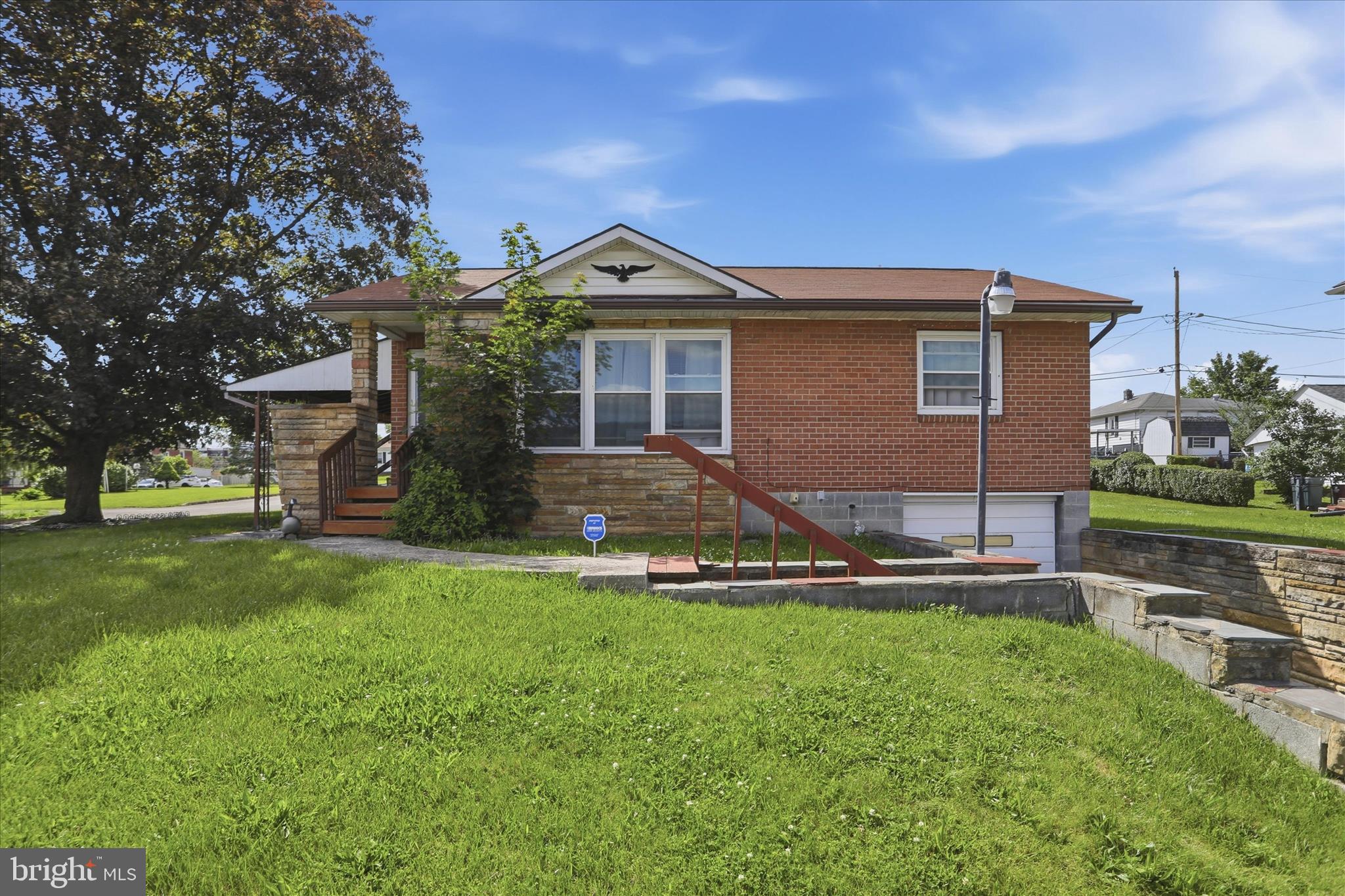 Well maintained brick rancher featuring two bedrooms, two full baths, and a finished basement on a spacious corner lot in Cumberland! Highlights include updated bathrooms, an eat-in kitchen, additional living space in the lower level, attached garage, rear deck, covered patio, and a large level yard. Conveniently located near shopping, dining, and everyday amenities. Move-in ready and full of potential!