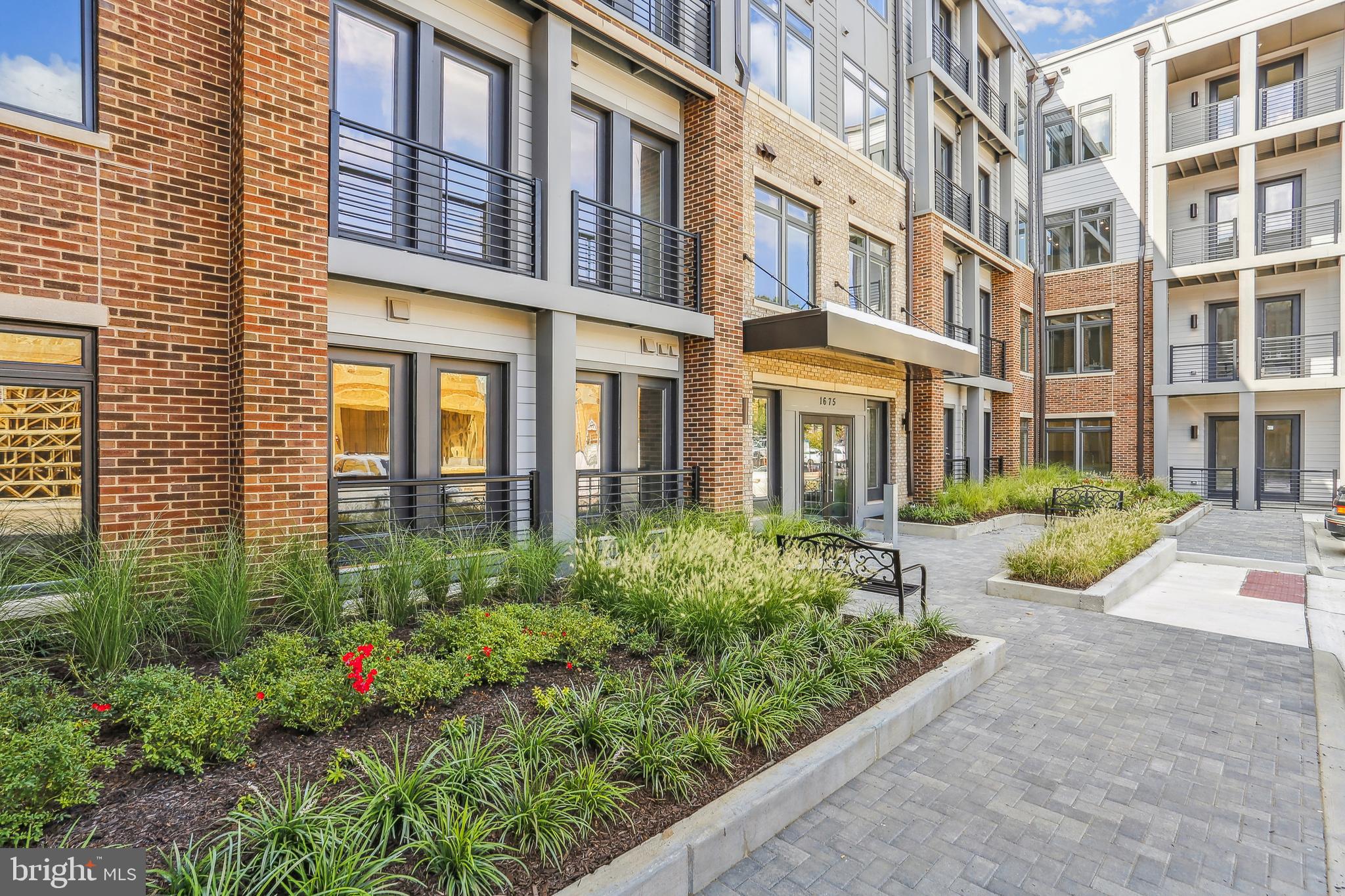 Experience modern luxury in this beautifully designed 3-bedroom, 2 bathroom, top-floor condo, complete with two dedicated garage parking spaces. Built in 2022 by Stanley Martin, this nearly new home offers the perfect blend of comfort, convenience, and contemporary style.

Enjoy the peace and privacy of top floor living, with no neighbors above you and enhanced natural light streaming through oversized windows. The elevated position offers quieter surroundings and a more serene atmosphere—ideal for relaxing on the balcony or working from home.

Inside, you'll find high ceilings, recessed lighting, and durable LVP flooring throughout, achieving a polished, sophisticated look. The gourmet kitchen with SS appliances, quartz counters and ample storage is sure to please. The primary bedroom suite offers a spacious full bath with walk-in shower and huge closet. With two additional spacious bedrooms, there's ample room to spread out, host guests, or set up a home office.  A second full bath and separate laundry room with side-by-side washer and dryer complete the home.

This one-level condo offers the ultimate in low-maintenance living—just lock and leave with zero exterior upkeep.

Set in a peaceful community just minutes from Plaza America, Reston Town Center, and the Wiehle-Reston Metro (just a mile away), it’s also a commuter’s dream with Dulles Airport only eight miles away.

Stylish, private, and perfectly located—this top-floor gem is modern living at its finest. Don’t miss it!