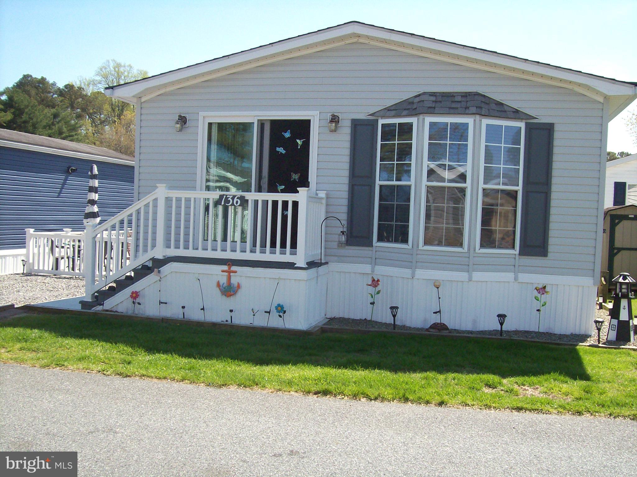 Welcome to the sought-after community of White Horse Park, a unique neighborhood of 465 privately owned properties where you own the land- no ground rent.  Full-time occupancy is permitted from April 1 through September 30, with additional limited use allowed for the rest of the year. October through March occupancy is permitted for sixty days not to exceed thirty days consecutively. This gated, year-round community offers private security with a guard, providing peace of mind and a welcoming atmosphere. This charming cottage features two bedrooms, and one spacious bathroom complete with a tub with enclosed shower, and convenient shelving for storage behind the door. The open floor plan seamlessly connects the living room and dining area, creating a comfortable and inviting space for relaxing or entertaining. A riverview from the living room  and outside patio. This home is located across the street from the marina and boat ramp. 
Outside, enjoy a complete patio furniture set, including a table, chairs, beach umbrella, rocking chair, and lounge chair. Additional features include three outdoor storage containers, a spacious shed with shelving, a motion detector light, and the convenience of a river and marina dock located just across the street. Inside, the home is equipped with ceiling fans, smoke detectors in every room and a carbon monoxide alarm. The home has built-in radio/tape players with speakers and light dimmers throughout 
The low monthly HOA fee of $180 includes water, sewer, trash, and access to a wide range of amenities such as a large community pool, clubhouse, pavilion for gatherings, boat launch, canoe storage, tot lot, basketball courts, picnic area, laundry facilities, and common area maintenance, as well as reserve funds and snow removal. 
Restaurants, shopping, churches, and beaches are all close-by. This home is ready to move in and just waiting for you!
Buyers and buyer agents are responsible for confirming all information. 
Please note that you must enter and leave the park with a real estate agent.
