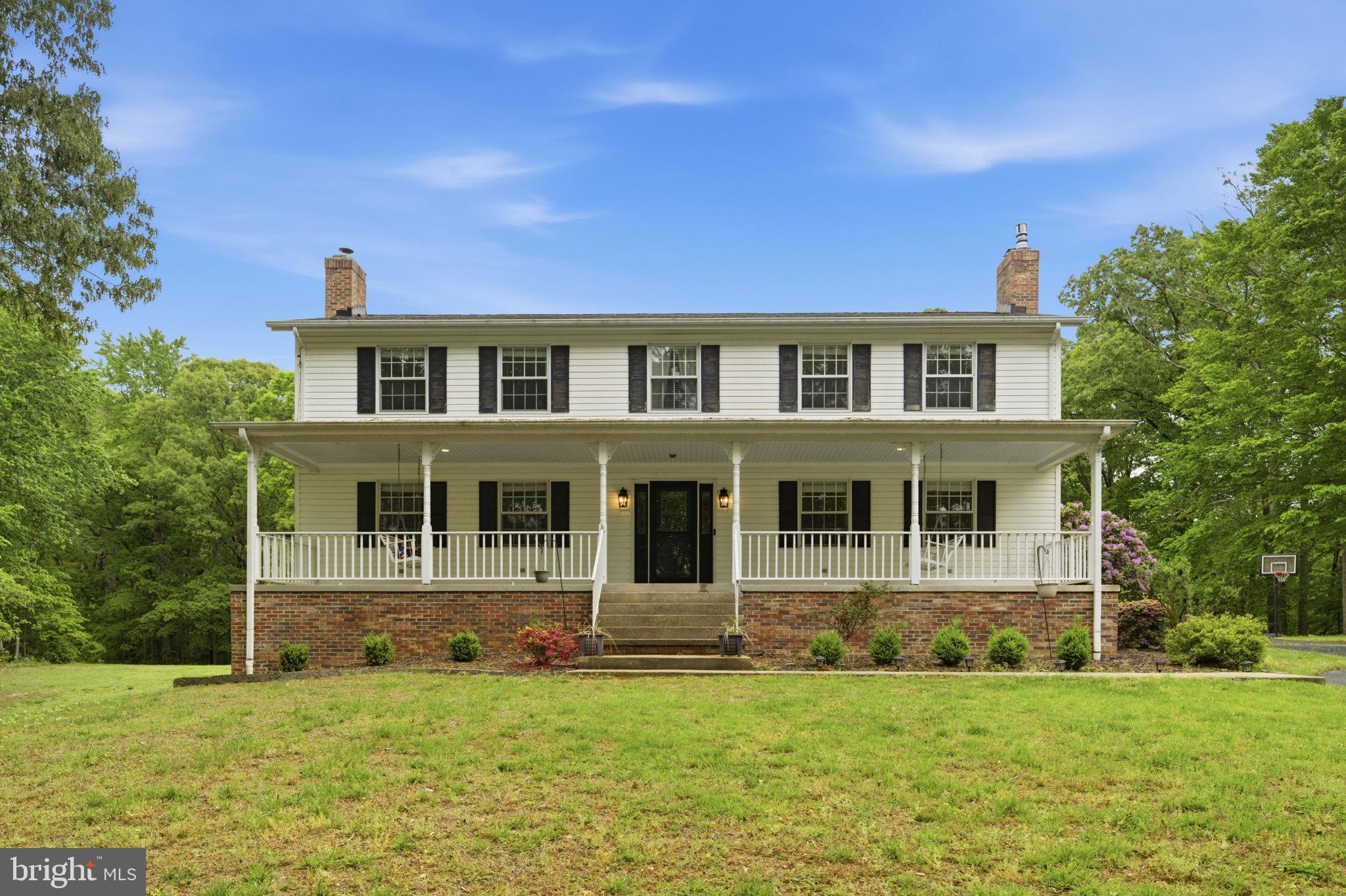 **Assumable VA loan available for qualified buyers, subject to lender and VA approval. Contact listing agent for additional details.**


Stunning custom home on Southgate Farm offering privacy, space, and beautiful indoor/outdoor living. Features include hardwood floors, spacious great room with fireplace and built-ins, updated kitchen with breakfast area, and a main-level primary suite with renovated bath. Upper level offers a second suite plus generously sized bedrooms with large closets. Finished walk-out lower level with rec space, full bath, and storage/workshop. Enjoy two covered porches, composite deck with ramp access, and a beautifully landscaped yard with treehouse, garden beds, and more. Oversized garage/workshop and ample parking. New water heater (March 2026) and all water filtration systems replaced (Jan 2026).