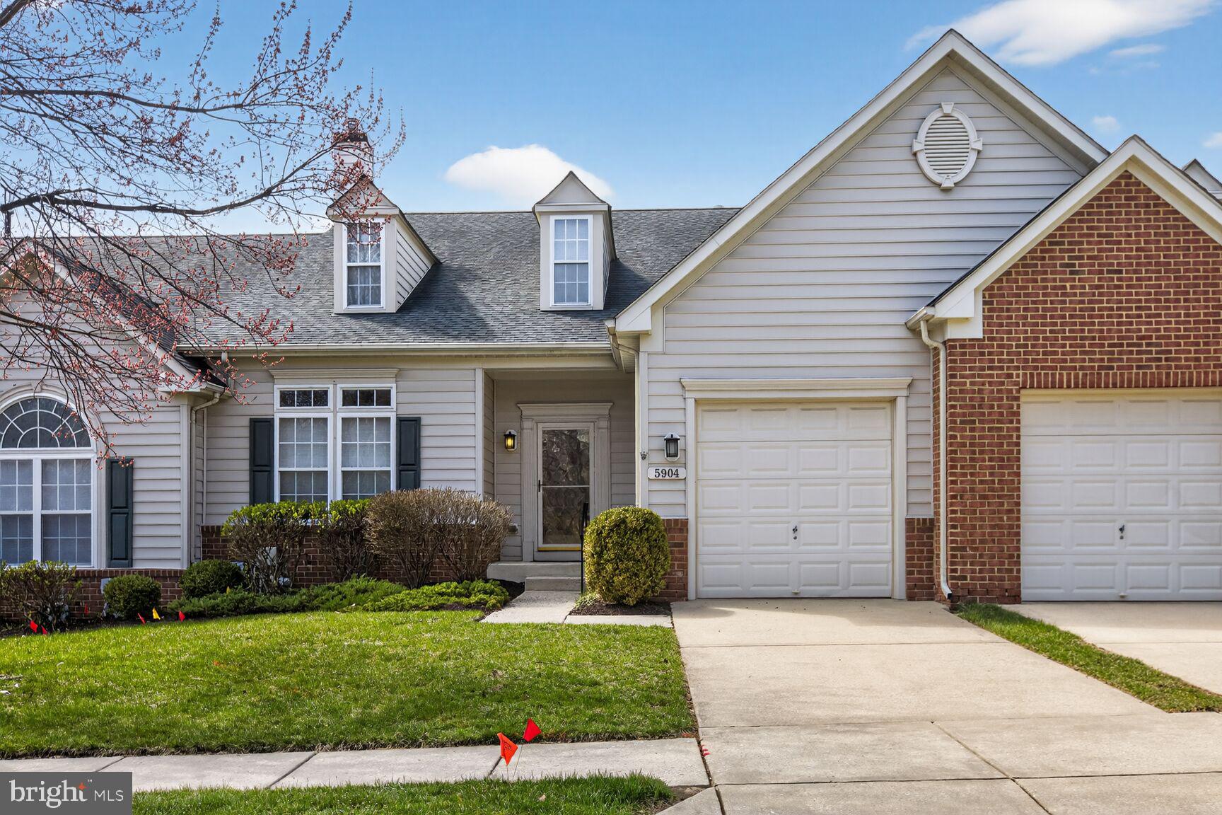 Welcome to this beautifully maintained 55+ villa in the sought-after Hearthstone community, where comfort and convenience meet. The open-concept main level features soaring vaulted ceilings, rich wood floors, and a striking three-sided gas fireplace shared by the living and dining areas, creating a warm and inviting atmosphere.

The chef’s kitchen offers 42” cabinets, granite countertops,—perfect for everyday living and entertaining. The main-level owner’s suite provides a peaceful retreat with a walk-in closet and a spa-like bath with an oversized shower.

Upstairs, a spacious loft offers flexible space for a home office or guest area, while the finished lower level includes a large recreation room with a rough-in for a future bath and room to expand. Enjoy the outdoors on the maintenance-free deck with a retractable awning.

Set in a quiet, park-like community just minutes from shopping and dining, this move-in-ready home offers easy, low-maintenance living at its best!