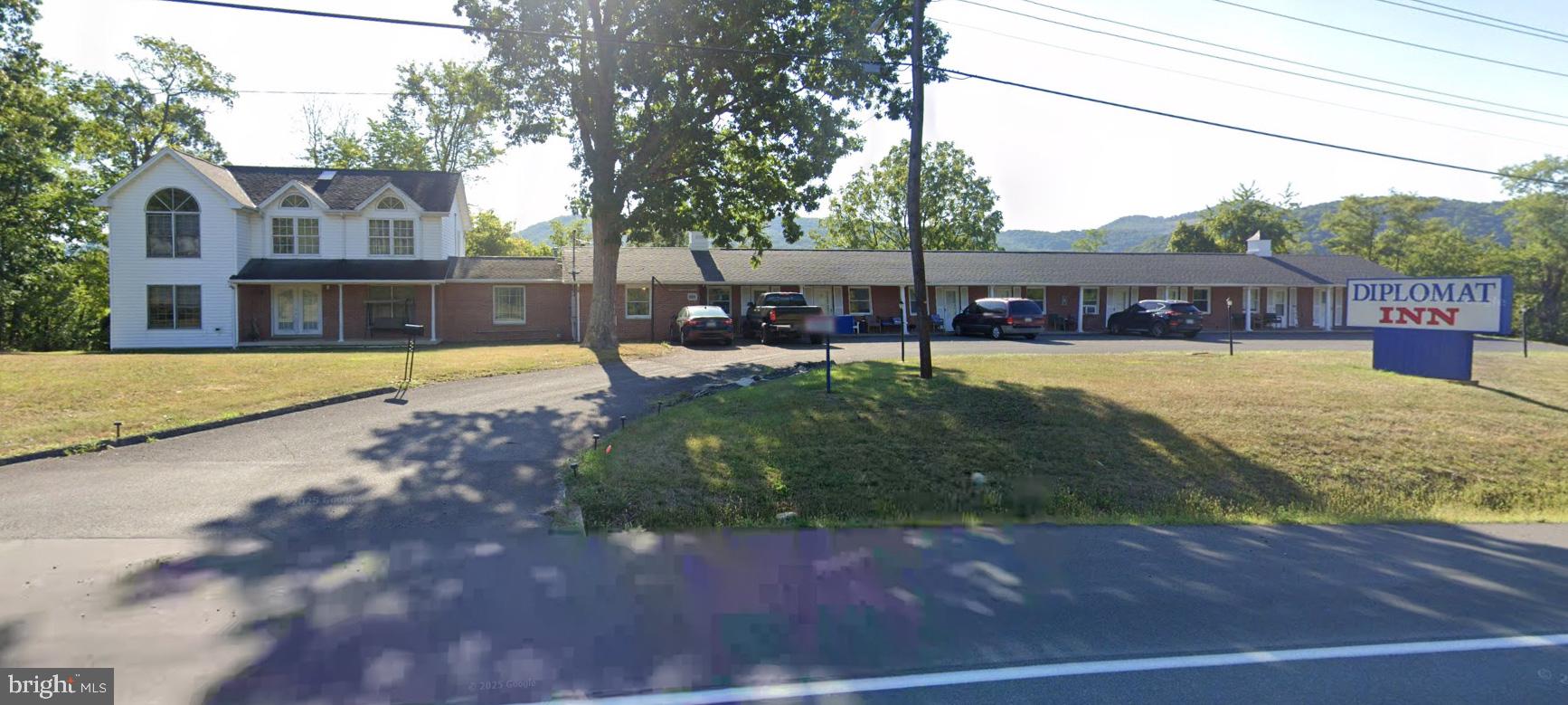 DIPLOMAT INN - TURNKEY INVESTMENT OPPORTUNITY WITH OWNER'S RESIDENCE. STRATEGICALLY LOCATED BETWEEN CUMBERLAND AND KEYSER, THIS CORRIDOR  SEES REGULAR COMMUTER, COMMERCIAL AND RECREATIONAL TRAFFIC - PROVIDING A BUILT-IN CUSTOMER BASE AND STRONG VISIBILITY. THIS PROPERTY FEATURES 16 GUEST ROOMS PLUS ATTACHED 4 BEDROOM, 2.5 BATH HOME - PERFECT FOR AN OWNER/OPERATOR OR ON-SITE MANAGER. EXCELLENT ROAD FRONTAGE AND AMPLE PARKING AND EASY ACCESS. THIS PROPERTY LENDS ITSELF TO A WIDE RANGE OF CREATIVE AND INCOME-PRODUCING USES INCLUDING TRADITIONAL MOTEL/BOUTIQUE ROADSIDE INN, EXTENDED-STAY OR WORKFORCE HOUSING, SHORT-TERM RENTAL CONVERSION (AIRBNB STYLE UNITS), CONTRACT HOUSING (TRAVEL NURSES, CONSTRUCTION CREWS, UTILITY WORKERS), TRANSITIONAL HOUSING OR ASSISTED LIVING CONVERSION, OUTDOOR RECREATION HUB (TARGETING HUNTERS, ANGLERS, AND CYCLISTS), BED & BREAKFAST WITH OWNER OCCUPANCY, CORPORATE OR GOVERNMENT LODGING CONTRACTS OR MIXED-USE REDEVELOPMENT. UNLIMITED POSSIBILITIES FOR THIS APPROX 1.69 ACRE COMMERCIAL PARCEL ON A HIGH-VISIBILITY, HIGH-TRAFFIC STATE HIGHWAY.