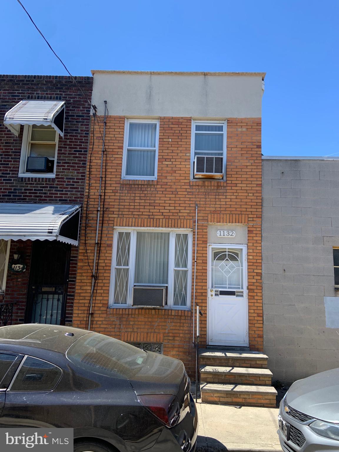 Passyunk Square Townhome with easy access to Center City Philly, East Passyunk Ave. Business District, 9th Street Market, and Penns Landing! Basement - partial and unfinished with washer/dryer and sound mechanicals. 1st Floor - Entry Foyer,  Living Room/Dining area combo with wrought iron stair railing, w-w carpeting, painted walls, and large front window; Modern eat-in kitchen UL oak wood cabinets, formica CTS, refrigerator,  hooded gas range, ceramic tile floor, and rear to door to private yard. 2nd floor - Large front bedroomwith SD closet, carpets and window AC unit; sitting room; rear 2nd bedroom with carpets and closet; Modern  and updated 3-piece ceramic tile bath, Newer Heater and Roof! Super convenient location!