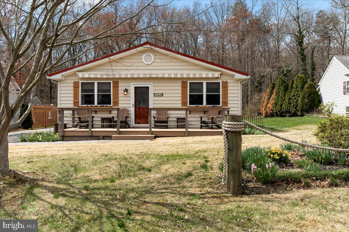 Welcome to 121 Woodall Road, a charming coastal retreat with 3-bedroom, 1.5-bathroom home in the desirable Greenbank community. Just five houses from the Chesapeake Bay, this home offers exclusive access to the private community beach, picnic area  and boat ramp, making it perfect for those who love life by the water!

Inside, you'll find an updated kitchen with modern finishes, granite countertops, stylish cabinetry, and ample counter space—ideal for cooking and entertaining. The updated bathroom adds a fresh and contemporary touch. Hardwood floors stretch throughout the home, enhancing its charm and timeless appeal.

One of the standout features of this home is the beautiful sunroom at the back, offering a peaceful retreat where you can relax and take in the views of the serene and quiet backyard. The home is also equipped with a Generac standby generator, ensuring peace of mind during any weather. Outside, you'll find a durable metal roof and a Leaf Filter gutter system, adding to the home's low-maintenance appeal.

The property includes two sheds—one with a garage door that is also heated, making it perfect for extra storage, a workshop, or year-round projects. A second smaller shed is ideal for lawn equipment.

Backing up to 8.955 wooded acres (also for sale, see 165 Woodall Road, Perryville MD), this home provides added privacy and the potential for expansion. Don't miss the chance to own both properties in this desirable water-access community!