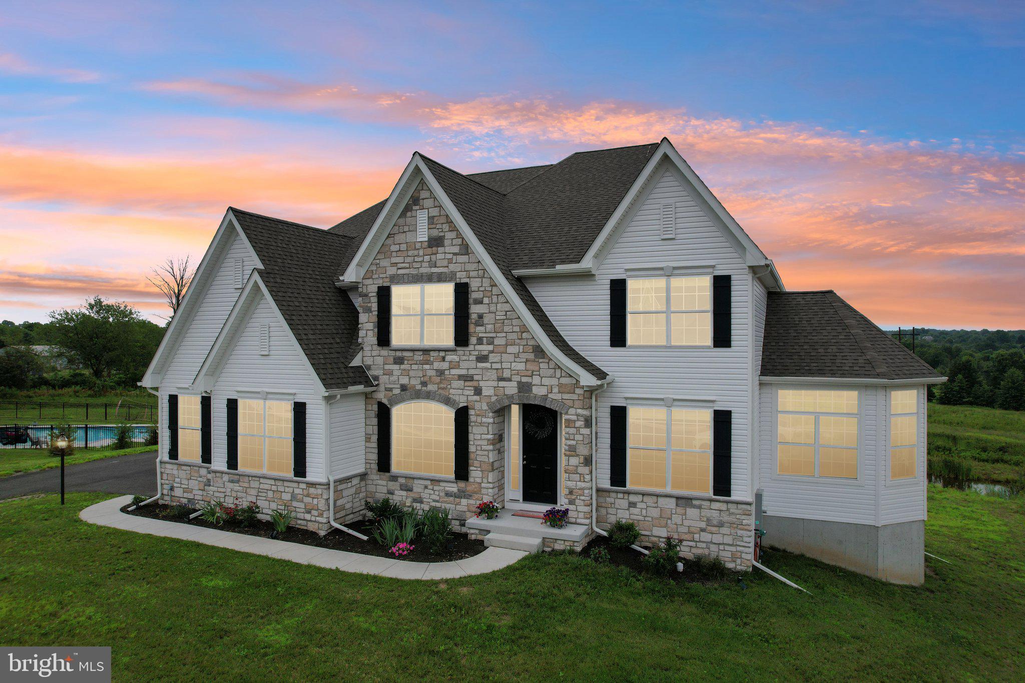 Welcome to 1832 Enclave Drive—an expansive, light-filled home in the sought-after Millstone at Parkside community. With over 5,000 square feet of beautifully finished living space, 5 bedrooms, 4.5 baths, and a 3-car garage, this property offers room to grow, relax, and entertain in style.

From the moment you step inside, you’ll notice the exceptional natural light that pours through the two-story family room and bright, open kitchen.  The granite island has seating for 6 and is great for everyday use and entertaining.  Whether you’re sipping coffee by the windows or hosting a lively dinner, the main living areas are always filled with sunshine and framed by peaceful views.

The thoughtfully designed layout includes a first-floor bedroom with full bath access, perfect for guests, home office needs, or added flexibility. Upstairs, the private bedroom suites offer comfortable retreats, each with generous closet space and well-appointed baths.  The Master BR gives beautiful views to the rear of the home.  It also has a full tile bath with standing soaking tub, tile shower, double vanity and more.  

The walkout basement is a standout; finished with high ceilings, open space for recreation or media, and plenty of windows that let the light stream in. It’s rare to find a lower level that feels this inviting.

Built just one year ago, this home combines the peace of a newer build with modern finishes and smart design choices. The exterior matches the interior’s appeal, set on a picturesque lot with scenic views in every season.

Millstone at Parkside offers a serene setting while keeping you close to everything. With easy access to Routes 309, 476, St. Luke’s Hospital, and the shopping and dining options of Quakertown, you’ll appreciate how connected yet tucked away this location feels.

Elegant yet warm, spacious yet welcoming—1832 Enclave Drive is ready for its next chapter. Come experience it in person—schedule your tour today!