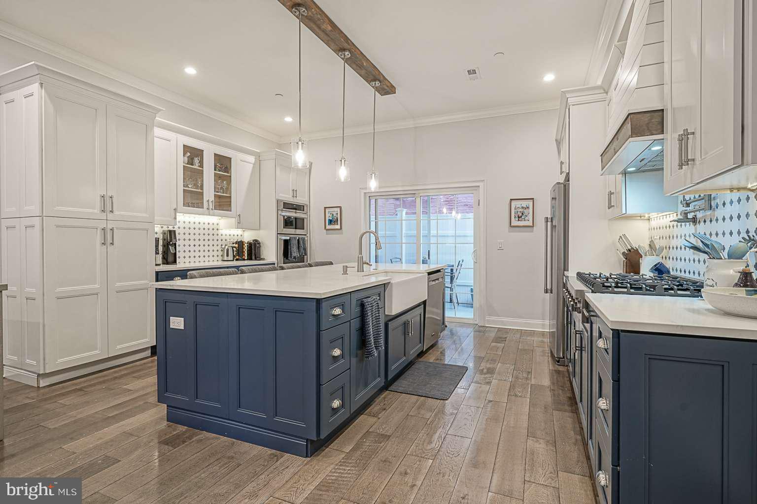 Step into this oversized 18 foot wide, 3 bedroom 4 bathroom custom built home and be amazed with the amount of space you have. The open concept living / dining room and kitchen space, complete with 10 foot ceilings and a private fenced in rear patio make the first floor a perfect place to host guests. The second floor features two bedrooms, two bathrooms and a spacious laundry room. The third floor boasts a large master bedroom complete with a private balcony, as well as a master bathroom with a soaking tub, double vanity, and an oversized shower. One more flight up is a large roof deck with a mini-bar that is ideal for hosting guests. The fully finished basement features extra living space, as well as a full bathroom and plenty of storage space. With three separate outdoor spaces, 2,500 SF of living space, and a 8 years remaining on the original ten year FULLY ABATED tax abetment, this home will not last long. Steps from Whole Foods, Palumbo Park and everything Bella Vista and Washington Square West have to offer. Make your appointment today. Priced to sell