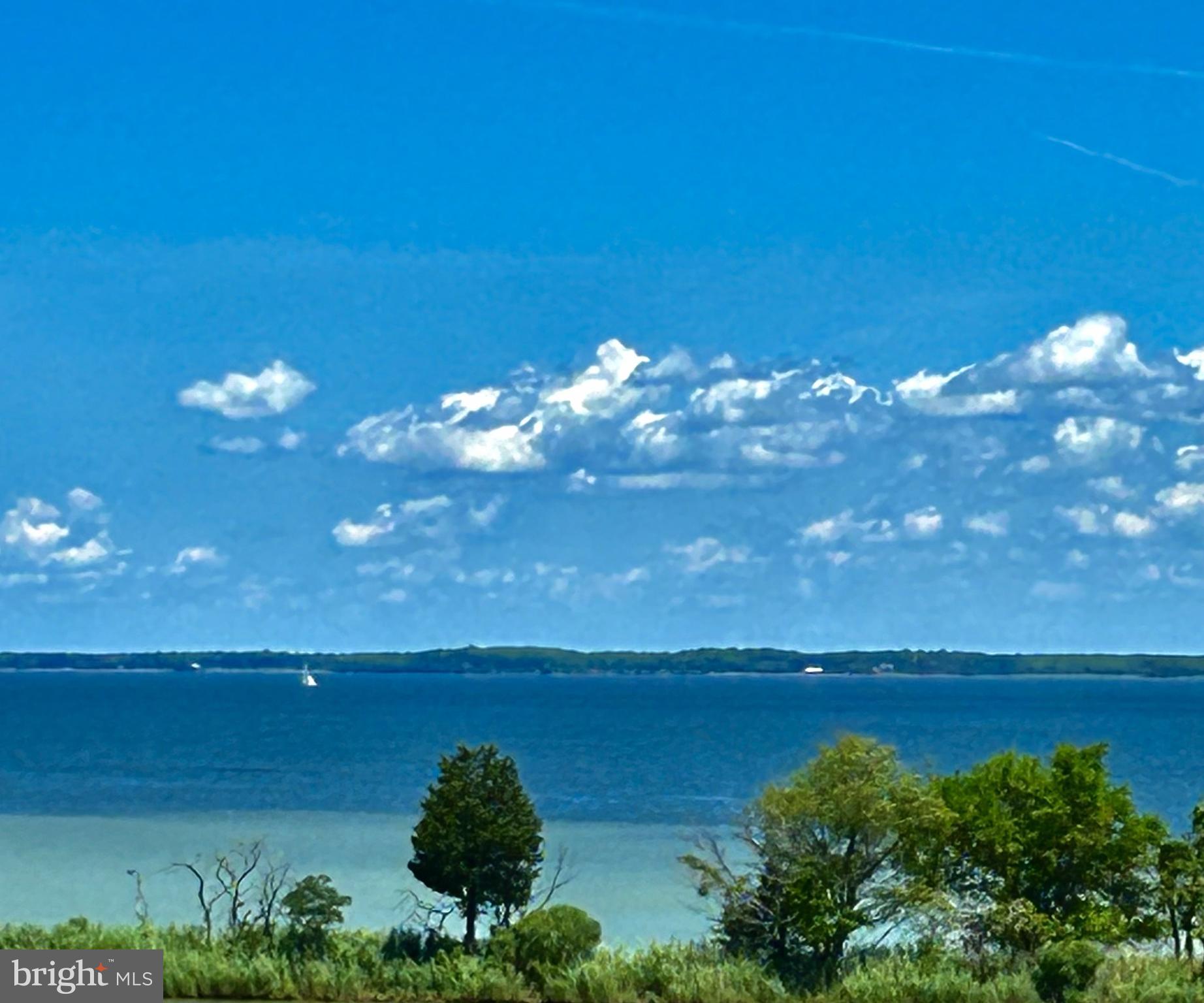 Open house Sunday June 14 11-1p.Penthouse Unit! Seller offering closing cost assistance to qualified buyers! Rare top floor unit with year-round water views perfectly positioned to capture stunning sunrises every morning. This home has been owned and meticulously maintained by the original owner who spared no expense and opted for every builder upgrade that was offered, over $60,000.00 in options. The open concept design seamlessly connects the living room, dining area, and kitchen areas, all enhanced by expansive windows letting in an abundant amount of natural light.  Experience resort style living in the highly sought after Four Seasons at Kent Island, a premier 55+ waterfront community.  Residents enjoy access to world class amenities, including indoor and outdoor pools, walking trails, a Chester River pier. Ideally located just minutes from waterfront dining, shopping, and the Chesapeake Bay Bridge, this home offers the perfect blend of relaxation, convenience and low maintenance living at its finest. Additional interior photos coming soon!