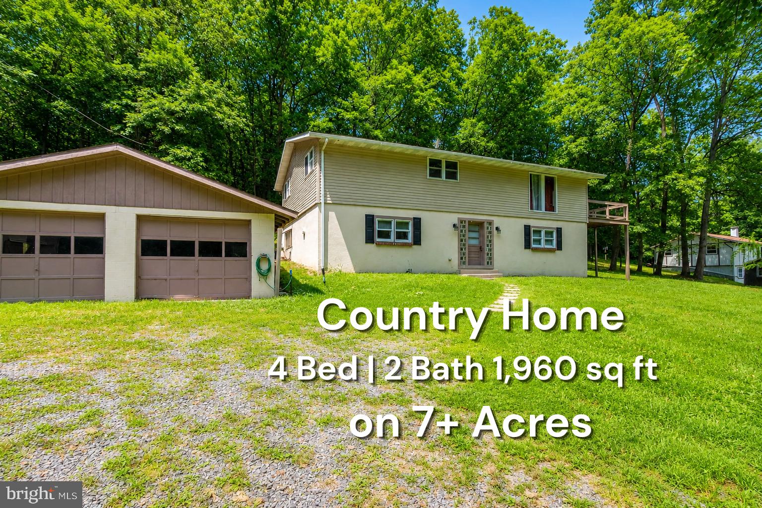 Whether you're searching for a weekend getaway, a year-round residence, or a nature lover's dream, this property meets every requirement. Step inside to an inviting open-concept main level featuring a bright living room, a spacious dining area, and a modern eat-in kitchen perfect for entertaining guests or enjoying cozy nights at home. Completely renovated, enjoy peace of mind with recent upgrades, including a new septic system (2022), central air conditioning, and updated appliances. The partially finished lower level offers a large family room and a fourth bedroom. You'll adore the sunroom, expansive deck, and nearby stream. The detached 2-car garage and impressive 44"x26" outbuilding provide plenty of space for a camper, boat, workshop, outdoor equipment, or all your recreational toys. Located just 25 minutes from Lake Raystown and close to State Game Lands, this property is ideal for hunting, hiking, fishing and year-round outdoor adventures. If you're ready to enjoy peaceful views, and easy access to nature, Happy Hills is calling your name.