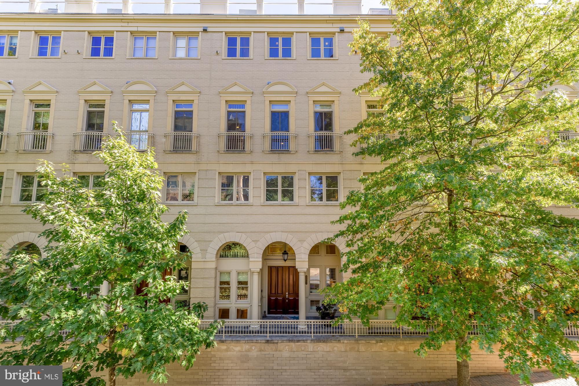 Expansive monument and Potomac River views define this five-level townhome in The Bromptons at Monument Place, complete with a rooftop deck designed to take full advantage of the setting. Offering approximately 3,556 square feet and elevator access to the main living levels, the home is thoughtfully arranged to place its primary entertaining spaces where the views are most impressive.

The entry level welcomes you with the front foyer and a comfortable media room. From here, the elevator provides direct access to the main living and entertaining levels above, allowing guests to move easily through the home while the bedroom levels remain private.

The top-floor main living level is positioned to fully capture the monument and river views. High ceilings, detailed mouldings, and a gas fireplace anchor the living room, while French doors open to Juliet balconies oriented toward the skyline. A separate dining space connects to the kitchen, which features stainless steel appliances, abundant cabinetry, and a paneled Sub-Zero refrigerator. One level higher, a rooftop deck provides exceptional outdoor space for entertaining, dining, or simply enjoying the sweeping monument and Potomac River views.

Below the living level, the primary suite occupies its own full level on floor 3 and offers two walk-in closets and a spacious marble bath with dual vanities, a soaking tub, and a separate glass-enclosed shower.  The next level down includes two junior suites, each with its own en-suite bath and walk-in closet, providing comfortable accommodations for family or guests.  

At the base of the home, a rear alley entry two-car garage connects to a flexible multipurpose room well suited for gym space, hobbies, storage, or additional work-from-home needs.  This level is also served by the private elevator making moving packages and groceries through the home a breeze.

Located just outside Arlington National Cemetery, The Bromptons at Monument Place offers convenient access to Rosslyn Metro, nearby restaurants and shops, Georgetown, downtown Washington, and Reagan National Airport.