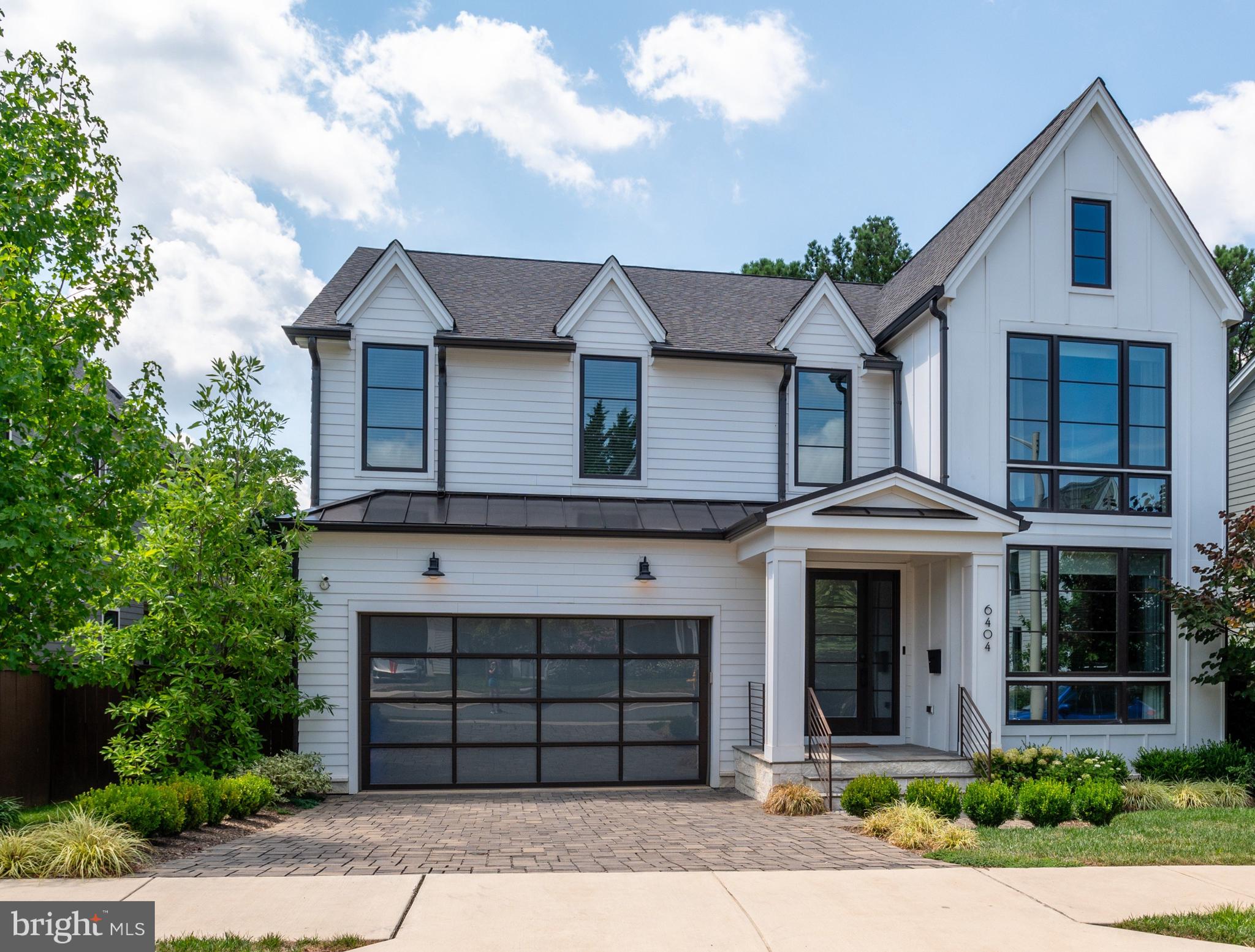 Another "Classic" Classic Cottages quality-built home with extraordinary improvements and upgrades to this 2018 built showstopper! This home shows better than new and is one you won't want to miss for so many reasons! Come see it soon! 
This immaculate and well-cared for home is stunning with 6-bedrooms, 4.5-bathrooms and a 2-car garage on a beautifully landscaped lot with lovely outdoor grill and terrace.  It is conveniently located in a private cul-de-sac near the heart of Arlington. Step inside and immediately apparent are the large windows and abundant natural sunlight with $85K in seller upgrades in addition to all the "bells and whistles" as the high-end, upgraded Fairfax model home for Classic Cottages in the Roosevelt Place development! Up to date in a Transitional/Contemporary/Farmhouse/Craftsman style this home is built and designed to appeal to the masses for a lifetime.  The chef's kitchen is a culinary dream, featuring upgraded Thermador stainless steel appliances, gas cooking, and a massive, oversized center island. A large butler's pantry conveniently connects the kitchen to the dining room. The spacious great room boasts a feature wall of a gas fireplace with a huge surround creating a perfect environment of aesthetic beauty and inviting for cozy evenings. A bonus room on the main level serves as an ideal main level bedroom or den/office space. Enjoy premium audio with ceiling-mounted speakers on the first floor, equipped with Sonos in the kitchen, living room, and dining room. The fully finished basement includes a huge recreation room with a large wet bar with a sink and beverage cooler, an exercise room, lots of storage and a guest suite with a full bathroom. Upstairs, the palatial owner's suite offers dual walk-in closets and a luxurious full bathroom with a soaking tub and walk-in shower. Three additional bedrooms and 2 additional baths are on the upper level and bedroom 1 has an En-suite bath. The backyard is an entertainer's dream, complete with a stone terrace and stone wall seating featuring a built-in grill. his home is equipped with all the modern conveniences, including a security system, smart lighting, thermostats, door locks, and a 2-car garage. The kitchen and bathrooms feature upgraded cabinets and countertops, while the upgraded fireplace and surround add a touch of elegance. Enjoy seamless connectivity with Wi-Fi extenders throughout and Ethernet ports in most rooms. Custom closet systems are in the primary bedroom, wainscoting on the first floor and in the master bedroom, and recessed lighting in all bedrooms add to the home's sophistication. Additional features include a whole house water filter, surge protector, irrigation system, gutters, an electric car charger, and more. Custom window treatments include Shade Store and Calico Corner's drapes, Hunter Douglas motorized shades, and wood Venetian blinds/roller shades throughout. The kitchen light fixture is on dimmer switches for added ambiance. Commuter convenient this home is ideally located close to major commuter routes, as well as the Orange/ Silver metro line (<1 block). This lovely home is only one Metro Stop to the new Capital One HQ and just 2 stops to Tyson's Corner. This exceptional home has it all and offers a perfect blend of location, location, location along with luxury, comfort, and modern amenities.