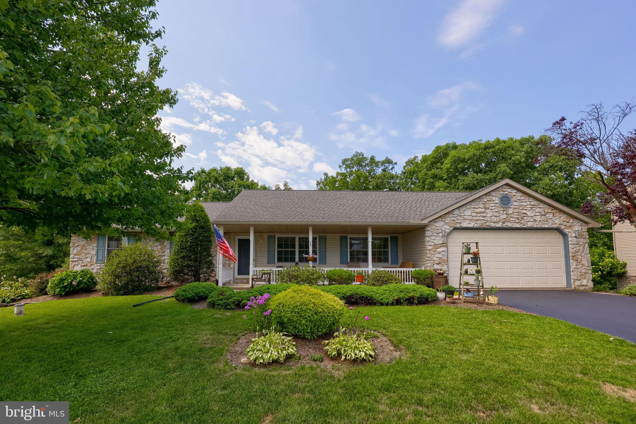 This multi-generational home, situated on 1.2 scenic acres in a quiet neighborhood with access to Muddy Creek, offers the perfect blend of space, comfort, and versatility. The main level features 3 bedrooms, 2 full baths, including a primary ensuite bath, a welcoming living room, and an eat-in kitchen with an island that opens to a spacious family room with a vaulted ceiling. The sunroom provides the perfect place to relax and enjoy the peaceful surroundings, while the convenient first-floor laundry and attic storage add everyday functionality.

The finished lower level, complete with its own outside entrance, is ideal for extended family, guests, or independent living. It offers 2 additional bedrooms, a full bath, a kitchenette, living room, and dining area, providing flexible living arrangements for a variety of needs.

Outside, you'll find a 2-car garage, a workshop shed with electricity and private deck overlooking the backyard, multiple storage areas, and beautifully established gardens. Enjoy peaceful outdoor living with room to explore and direct access to Muddy Creek. Recent updates, including a newer roof, water heater, and central air conditioning unit, add value and peace of mind. Offering exceptional flexibility, privacy, and natural beauty, this one-of-a-kind property is ready to welcome you home.