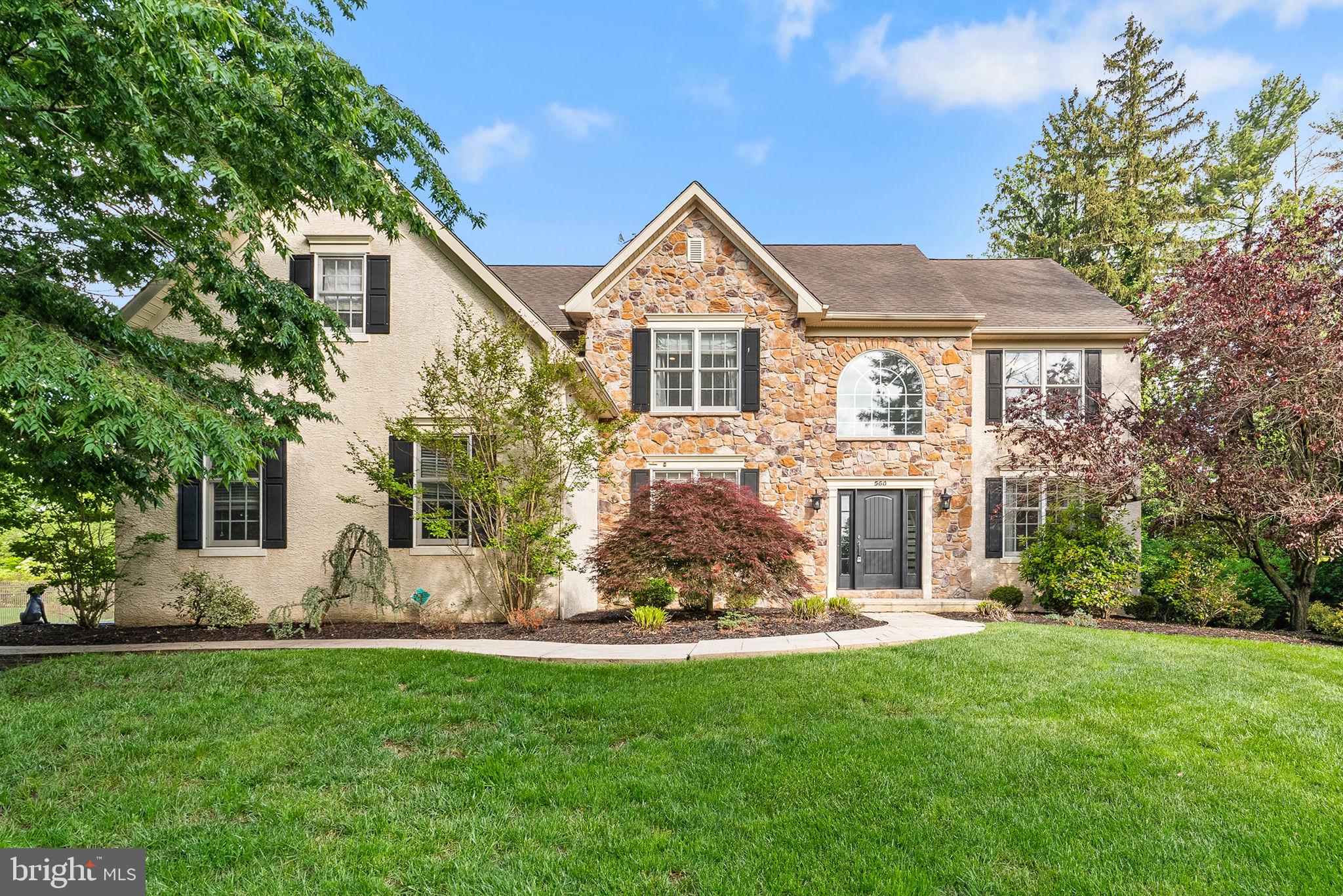 Welcome to 560 Buckley Road, an exceptional custom-built home tucked away on a quiet  lane in prestigious Lower Gwynedd Township. This refined 4 bedroom residence seamlessly blends timeless elegance with modern comfort—and is move-in ready for your summer enjoyment. Step into a soaring two-story foyer with gleaming hardwood floors, setting the stage for a thoughtfully designed interior. Work from home in style in the private office with French doors, while across the foyer, the formal living room and dining area offer seamless entertaining space with custom millwork and architectural arches. At the heart of the home is a chef’s dream kitchen, featuring soapstone countertops, premium stainless steel appliances, an induction cooktop, farmhouse sink, pull-out spice racks, and a statement island with vegetable sink and bar seating. Sliding doors open to a lush, professionally landscaped backyard with a stamped concrete patio—your own peaceful retreat ideal for entertaining or relaxing.  Flowing effortlessly from the kitchen, the two-story great room boasts floor-to-ceiling stone fireplace, oversized windows, and abundant natural light. A custom mudroom with built-ins connects to the oversized 2.5-car garage, complete with Tesla vehicle charger and convenient outdoor access.  Upstairs, retreat to your luxurious primary suite with a massive custom walk-in closet, spa-like bath with custom double vanity, water closet, and tiled shower with pebble stone flooring. Three additional spacious bedrooms and a beautifully updated hall bath complete the second floor. Need more space? The finished lower level offers a full bath, potential 5th bedroom or gym, and ample storage.  This home is loaded with energy-efficient upgrades including Tesla solar panels, two Tesla Powerwalls for backup energy, and an EV charger—offering peace of mind and future-ready living.  Walk to top-rated Wissahickon schools, nearby trails, parks, and enjoy easy access to regional rail and major highways.  ✨ Private. Elegant. Efficient. Schedule your private tour today—homes like this are rare in Lower Gwynedd!
