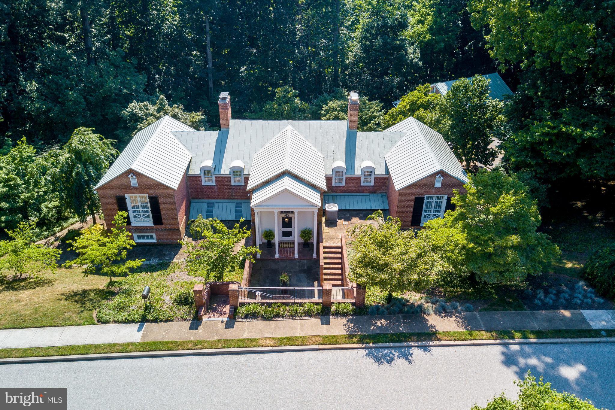 An exquisite Roland Park residence awaits on coveted Blythewood Road!  Jeffersonian architectural perfection abounds in this meticulously renovated showplace.   Nestled on private 2 acre oasis backing to Stoney Run Park, with your own gated access to enjoy walks to nearby Roland Park shops.   Elegant formal rooms,  high-end gourmet kitchen with butlers pantry, awning-covered bluestone patio overlooking an inviting in-ground pool, impressive guest house and 3 car garage.  Modern luxuries enhance the timeless grace of this stately property!