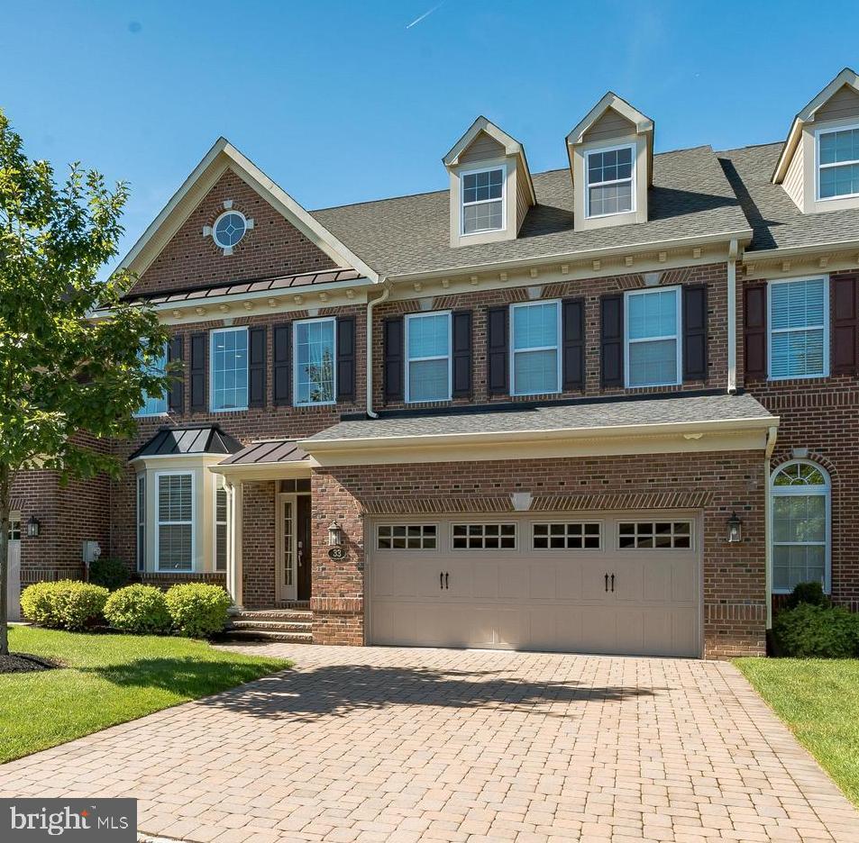Welcome to Delancey Court, one of the premier 55+ Active Adult communities in the Bucks County area. The communities’ architectural style mimics the historic Philadelphia Neighborhoods featuring cobblestone driveways and brick exteriors. This  "Paxton"  model is upgraded throughout! The custom paver driveway and walkway lead to the covered porch and entry to this magnificent home. The two plus story formal living room provides a dramatic entry and features hardwood flooring, which can be found on the entire main level. The sunlit 2-story formal living room includes custom wainscot, crown and chair moldings, 6’ baseboards, recessed lighting and a turned staircase featuring metal spindles with a carpet runner and custom balusters which leads to the Upper Level. The formal dining room includes a tray ceiling with a custom crown molding inset, wall sconces, wainscot and chair rail and is open to the kitchen and family room areas.  There is a bar with Quartz top and wine cooler to service the family room and kitchen,  The gourmet kitchen boasts upgraded Quartz counters with subway glass tile backsplash, upgraded custom cabinetry with under mount and top lighting,  all Viking upgraded stainless-steel appliances including a wall oven and microwave, a 6-burner gas cooktop with high velocity vented hood,  dishwasher and an extra-large island with Quartz counters. The expansive island features additional double-sided cabinets and drawers for extra storage and seating and opens to the adjacent 2-story sun drenched  large Family Room with gas fireplace, recess lighting, large windows and sound system is exquisite living space.  The adjoining breakfast room features a glass door which accesses the expansive paver patio, custom retaining wall with professional plantings and fenced backyard and is a great place to relax or entertain. Outside the fenced area is an open yard with recently planted evergreens for additional privacy.  First floor owner's suite complete with hardwood flooring, 2 large walk-in closets with custom professional organizers, 2 additional closets, tray ceiling, ceiling fan, recess lighting and custom moldings is polished and sophisticated.  The luxurious bathroom complete with soaking tub, large walk in shower, marble counter tops double vanity and dressing area is gorgeous!  A Powder Room,  laundry room and large walk-in closet complete the main level of this beautifully appointed home. The grand circular staircase leads to the second level which features a spacious loft with balconies overlooking the 2 story living and family rooms, hardwood flooring enhances this large loft area with custom built cabinetry used as office space is perfect working at home. Two additional specious bedrooms, a hall bath with dual vanity, and a large storage closet complete the Upper Level. A staircase leads to the 3rd Level  loft area which features large game room, rough in for additional bath and upgraded carpet is great additional space. Other amenities include a security system, custom window blinds,  2 car oversized garage, multi-zone HVAC, nest system, smart house technology, Sonos sound system, gas cooking, a paver/cobblestone driveway, extensive landscaping and much more! This home was designed for maximum comfort and luxury with minimal maintenance. Within close proximity to historic Newtown Boro with its shopping and dining, easy access to I-95 and the Pa & NJ turnpikes, this location makes traveling to Philadelphia, Princeton, New York and the New Jersey Shore an easy commute. The Delancey Court community features a private clubhouse, fitness center, indoor and outdoor pools, bocce court, conference room, game room and great room with a catering kitchen. This home is very well maintained and is move-in mint condition!