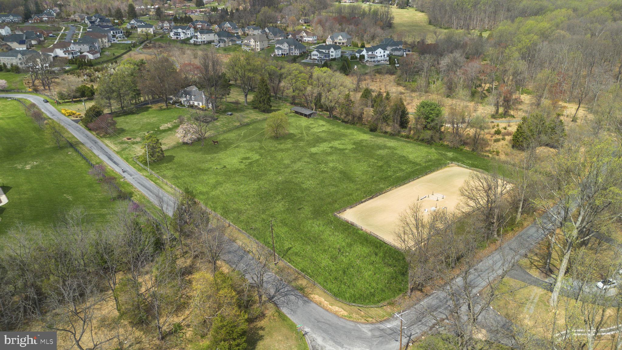 A rare 6.63-acre equestrian farmette in the heart of Olney offers privacy, charm, and exceptional horse amenities. One of the last large parcels in Southern Montgomery County, this property is adjacent to a 1,150-foot forest conservation easement with direct access to public trails. The updated 1932 Cape Cod blends historic character with modern comfort featuring refinished hardwood floors, new windows, a renovated kitchen with energy-efficient appliances, fresh interior/exterior finishes, and 3 bedrooms, as well as 3 full baths. EQUESTRIAN FEATURES INCLUDE: Amish-built 3-stall barn with tack room, hot/cold water & electric; FEI regulation-size outdoor riding ring with lighting; open pasture and flexible layout; agricultural tax benefits; and potential stall income (approx. $1,500/month. 
This farmette is a stone's throw from the best of public & private schools and is located minutes from all that Olney has to offer by way of athletic facilities, Starbucks, Roots Market, restaurants, breweries, multiple grocery stores, & Medstar Montgomery and has easy access to Georgia Avenue & the ICC. The home is less than 34 miles to Downtown Washington, approx. 7 miles to the nearest Metro station, and under 40 minutes to three major airports. It's a gem tucked away in a landscape of protected forest, open pasture, & big-sky views, yet close to everything including. The open space is a great chance to create outdoor living spaces, add a pool, or build a luxury residence that fully embraces the sweeping views and protected surroundings. This is a rare opportunity to own a private estate property that feels worlds away, yet remains effortlessly connected, offering a unique blend of convenience, charm, equestrian lifestyle, & long-term potential. A detailed list of recent property improvements is available upon request!
Sellers have purchased a transferable 1-year home warranty which began 4/1/26.