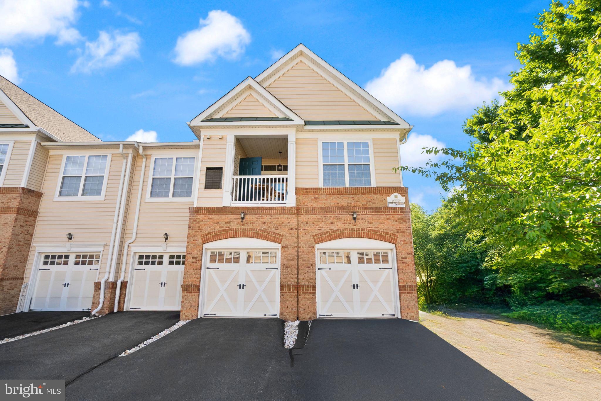 The owner is willing to  pay the one-time $2,500 Capital Contribution Fee. 
Located in the heart of Loudoun County, with access to the premier Belmont Country Club for golf, tennis, pickleball, and resort-like amenities.  This home is move-in ready and thoughtfully refreshed by the original owner; it showcases sophisticated upgrades throughout, including a stunning, spa-inspired primary bathroom, fresh designer paint, plush new carpeting, and rich hardwood flooring that adds warmth and timeless appeal.  This home is designed to make everyday living more convenient; walking from the garage with groceries or bags to the main-level kitchen is a fabulous feature.  The center of the home offers a spacious chef's kitchen designed to impress, with granite countertops, stainless steel appliances, a new built-in microwave oven, generous cabinetry, and abundant prep space for meals and baking—perfect for everything from casual morning coffee to entertaining family and friends. The open-concept living and dining area is warm and inviting, filled with natural light from the many windows in the corner-unit design. Stepping outside to the private balcony through light-filled double sliding doors, on a corner lot, peaceful and tree-lined views create the perfect setting to relax, have wine, or read a book. This unit is in a very private, quiet area, with pristine landscaping throughout the community. Upstairs, the wide staircases with oversized windows lead to the spacious primary suite, a private retreat complete with a large walk-in closet and a beautifully updated, spa-inspired primary bathroom featuring a luxurious soaking tub—an ideal escape at the end of the day. A generously sized second bedroom and full bath offer flexibility for guests, a home office, or other uses, with convenient upper-level laundry. Additional highlights include a one-car garage with extra storage space, the ability to easily park two cars in the driveway a huge benefit, and plentiful visitor parking.
Beyond the home, enjoy the exceptional lifestyle that Belmont Country Club is known for. Residents have access to outstanding amenities, including a premier golf course,  swimming pools, walking trails, tennis, pickleball,  playgrounds, a clubhouse with a fabulous dining room and a stunning patio for outdoor dining, and beautifully maintained common areas. Lawn care and snow removal are included, allowing you to spend more time enjoying everything the community has to offer. Ideally located near Dulles airport, One Loudoun, downtown Leesburg, major commuter routes, and premier shopping. Within walking distance of exceptional dining and Whole Foods, and with easy access to the W&OD Trail for walking, running, and cycling, this is the carefree lifestyle in a premier location with resort amenities.