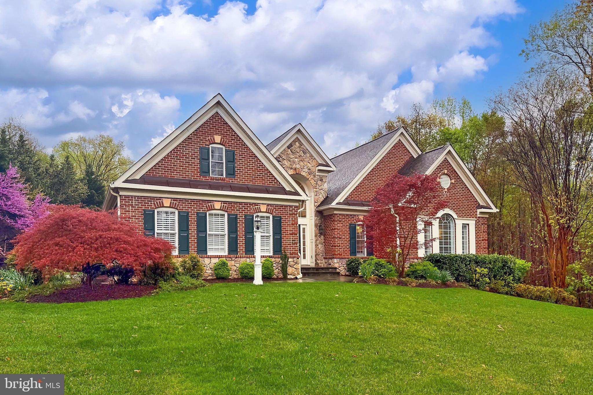 Come visit the wonderful community of the Reserve at Hunter's Ridge with large private lots full of mature trees and lots of wild life.  This custom built brick and stone ranch was built by Quaker Custom Homes with the pool and outside living features designed and built by Town and Country Pools.  This home is unique to the community with all 3212 square feet on one living level.  This main level living space includes 3 bedrooms, each with its own private bath, an office with decorative built-ins, a very large dining room, an eat-in kitchen with a breakfast bar and breakfast table area and an adjoining Family Room with gas fireplace.  There is also a sunroom which lead directly out to the concrete and stone patio overlooking the private pool, pergola and expansive concrete decking.  Between the kitchen and the 3-car, end load garage is a large pantry as well as a mud room/laundry room with separate entrance.  As a bonus, most of the walkout basement has been finished.  There is approximately 2000 finished square feet of living space which consists of a large bedroom with a walk-in closet and semi-private luxury bath, a bonus room, a walk-out rec room (with full sized windows providing plenty of natural lighting) for all of the many purposes you can find for the space, a kitchenette with microwave, beverage refrigerator and a sink, and more than 1200 square feet of storage space, because you just cannot have enough.  Well, this may be enough!!  Some of the dramatic features that enhance the appeal of all of this space are: 9' ceilings, 12' ceilings, double tray ceilings, custom tray ceilings, custom casings, wood floors, crown moldings, chair rail moldings, shadow boxes and so much more!!  Come see this home for yourself.  You will love it!!