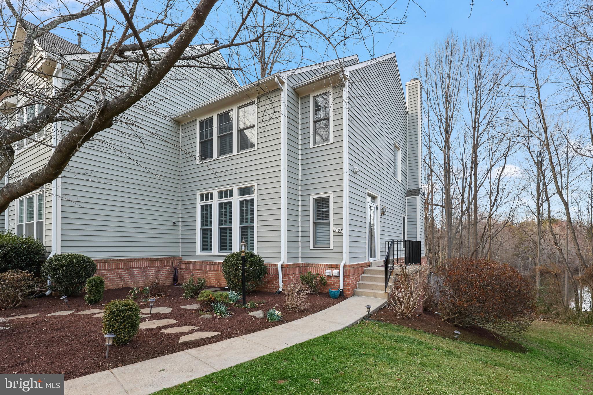 Welcome to rarely available, immaculate end-unit , Townhouse in Reston , with gorgeous pond views and backing to pond and woods!!  ***Recent updates-Fresh paint (2025), Brand New Plush carpets on Stairs and the second level (2025),New Hardwood Floors on the main level(2025),  Dishwasher (2025), updated master bathroom lighting (2025); New Washer Motor (2025), Dryer (2024); Storm Doors (2023), Five Windows (2023), Rain Gutters Replaced (2021) ,  Exterior Paint (2023)****Step inside an inviting open floor plan, where high-end hardwood flooring enhances the main level's modern appeal, complemented by cozy carpet on the upper and lower levels. The living room, with its stylish built-ins, entertainment area,  flows seamlessly into the open kitchen featuring granite counters, stainless steel appliances, a charming breakfast nook which is perfect to enjoy your morning tea /coffee meals while enjoying the pond views in the back and access to the  expansive deck backing to woods  & pond—perfect for outdoor dining and entertaining in complete privacy!!  Retreat to the generously sized primary bedroom, complete with an ensuite bathroom offering dual sinks and a spacious walk-in closet.  Additional bedrooms provide plenty of space for comfort and creativity. The lower level offers a versatile flex space with a welcoming fireplace, ideal for cozy gatherings and a home office /entertainment area! . . Step outside from the basement to enjoy the patio, overlooking the tranquil Bright Pond—a serene backdrop for relaxation. There’s a neighborhood playground 75 yards away .   Nestled in the sought-after Weatherstone Cluster of the Reston HOA, you'll enjoy a vibrant community atmosphere and access to exceptional amenities. Conveniently located near shopping, dining, Baron Cameron Park, and major commuter routes including 286 and Route 7, this home perfectly blends comfort, style, and convenience.