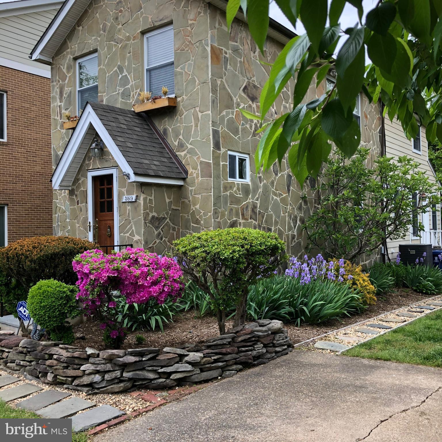 This charming and eclectic stone house is full of vintage character and is situated on a spacious double lot, providing ample outdoor space for relaxation, potential expansion & off street parking! Excellent commuter location adjacent to Arlington Ridge, Amazon HQ2, easy access to multiple bus routes W Glebe Rd/ Mt Vernon,  Vibrant Potomac Yard Metro station, Reagan Airport, Washington D.C. Pentagon City, Del Ray & Old Town Alexandria, King St. Enjoy the exciting variety of draft houses & unique restaurants & Pubs in Del Ray/St. Elmo's community! 
Step inside to discover a welcoming living room featuring a custom Samsung "Frame" TV complemented by a high-quality Polk sound system &  Sonos Amplifier.  The main level also features a large private bedroom space with an ensuite bathroom. Upstairs is the large primary bedroom featuring two walk-in closets, a flex office/workout space, and two additional closets! Also upstairs is a 2nd full bedroom and full bathroom. 
This bungalow beautifully combines comfort with modern amenities, making it an ideal place to call home.    Additional features include; Hardwood floors throughout, copper gutters and downspouts,  stunningly remodeled kitchen and bathrooms, 5 Burner Gas cooktop, convection oven, recessed lighting , newer gas hot water heater,  new front load washer/dryer upstairs and additional storage and flex space in the unfinished basement. 
This property truly has it all—character, space, and an unbeatable location with potential to expand! Make sure to check out the virtual tour!